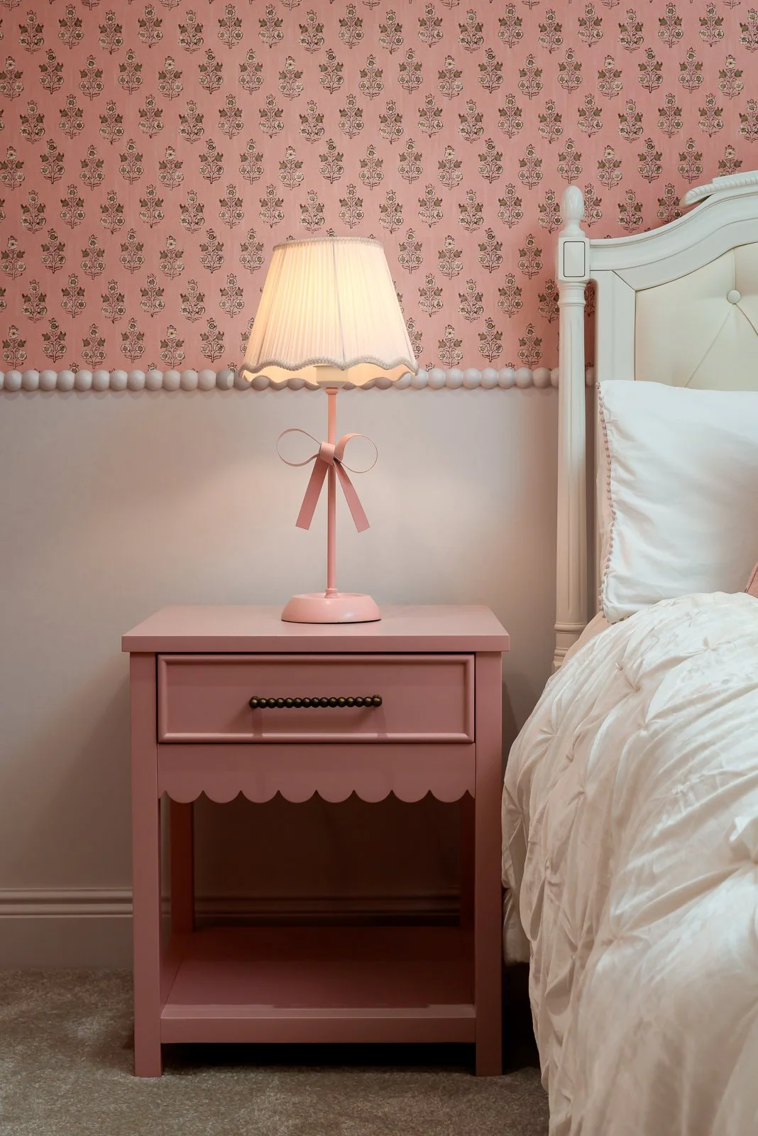 Bedroom detail at Newlands by Rebecca Sudic Interiors, showing soft colour, styling and fitted furniture within the completed family home.