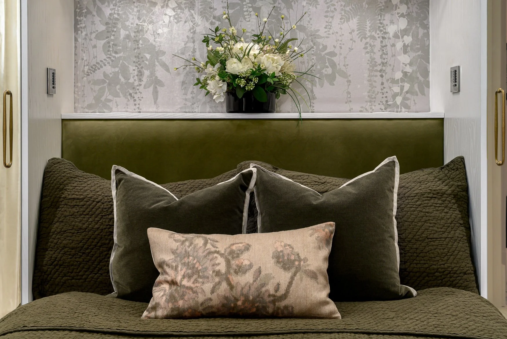 guest bedroom with bespoke green upholestry, close up on cushions 