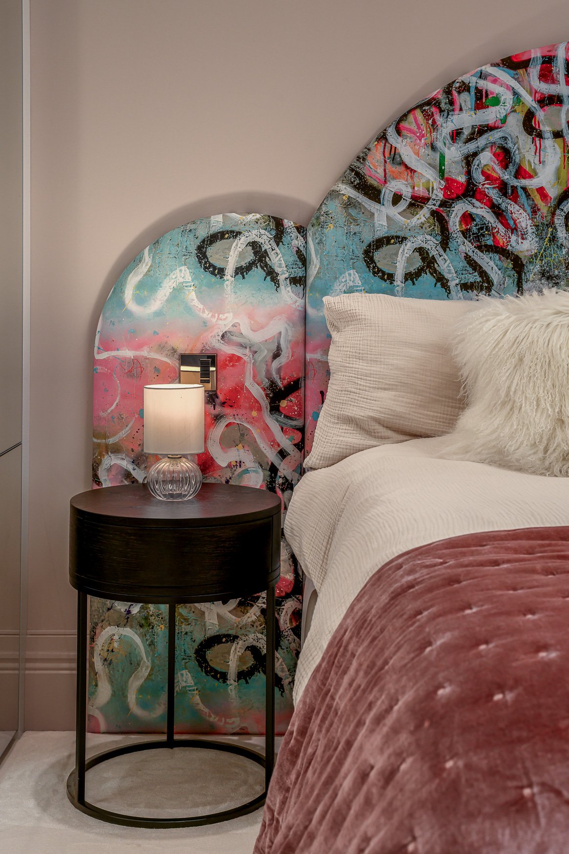 Children’s bedroom detail with playful graffiti  bed's headboard