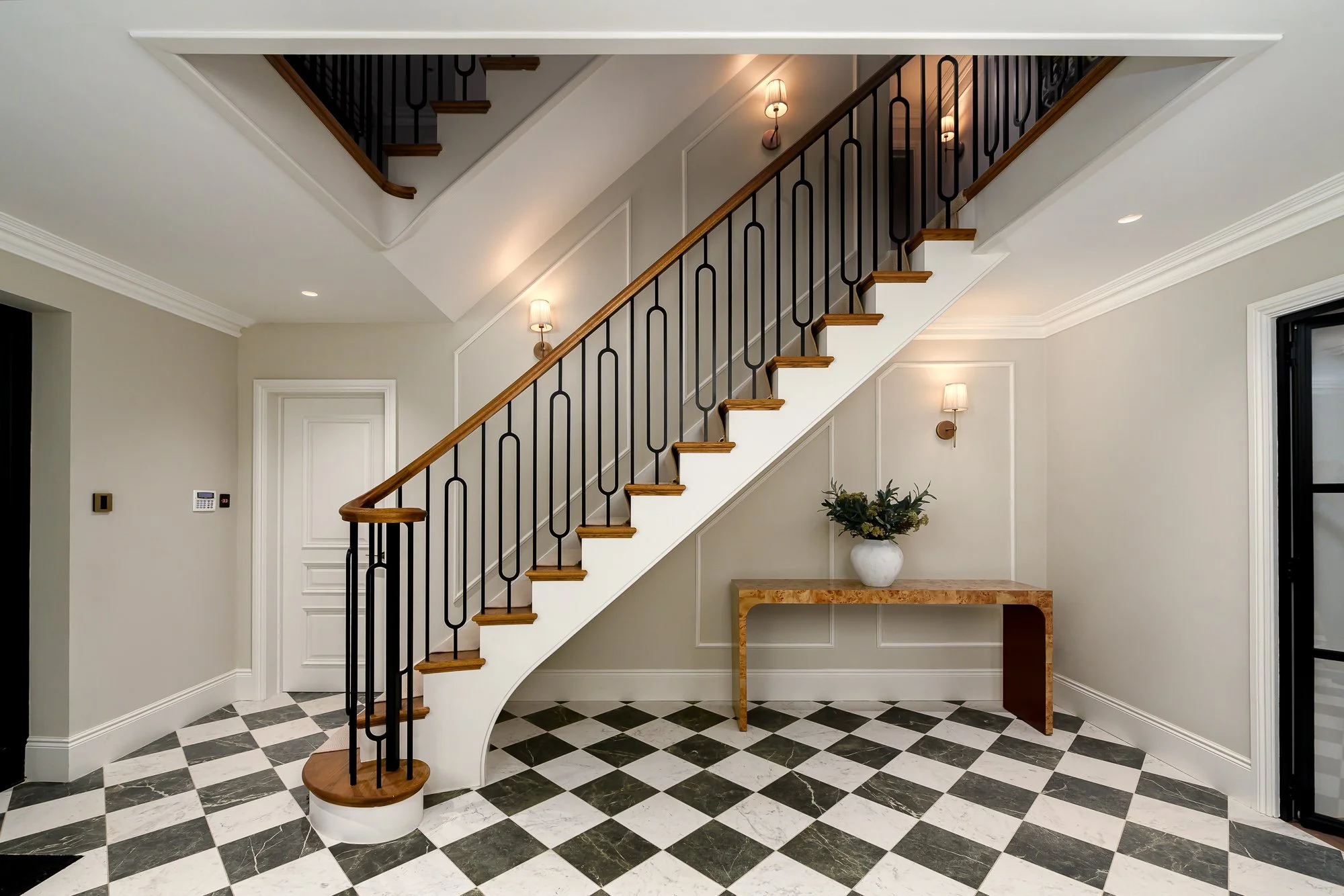 Architectural photography of a luxury London property development featuring staircase, marble flooring and bespoke interior detailing.