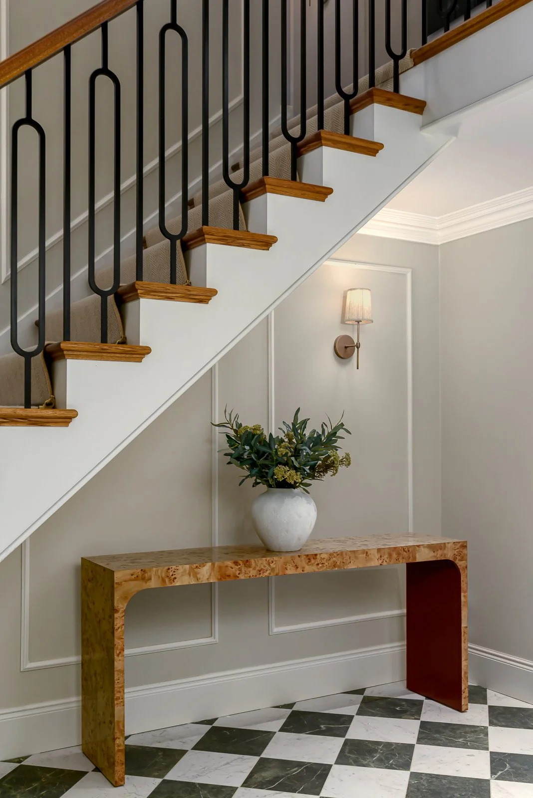 Hallway and staircase detail at Newlands by Rebecca Sudic Interiors, showing patterned flooring, bespoke joinery and the home’s architectural character.