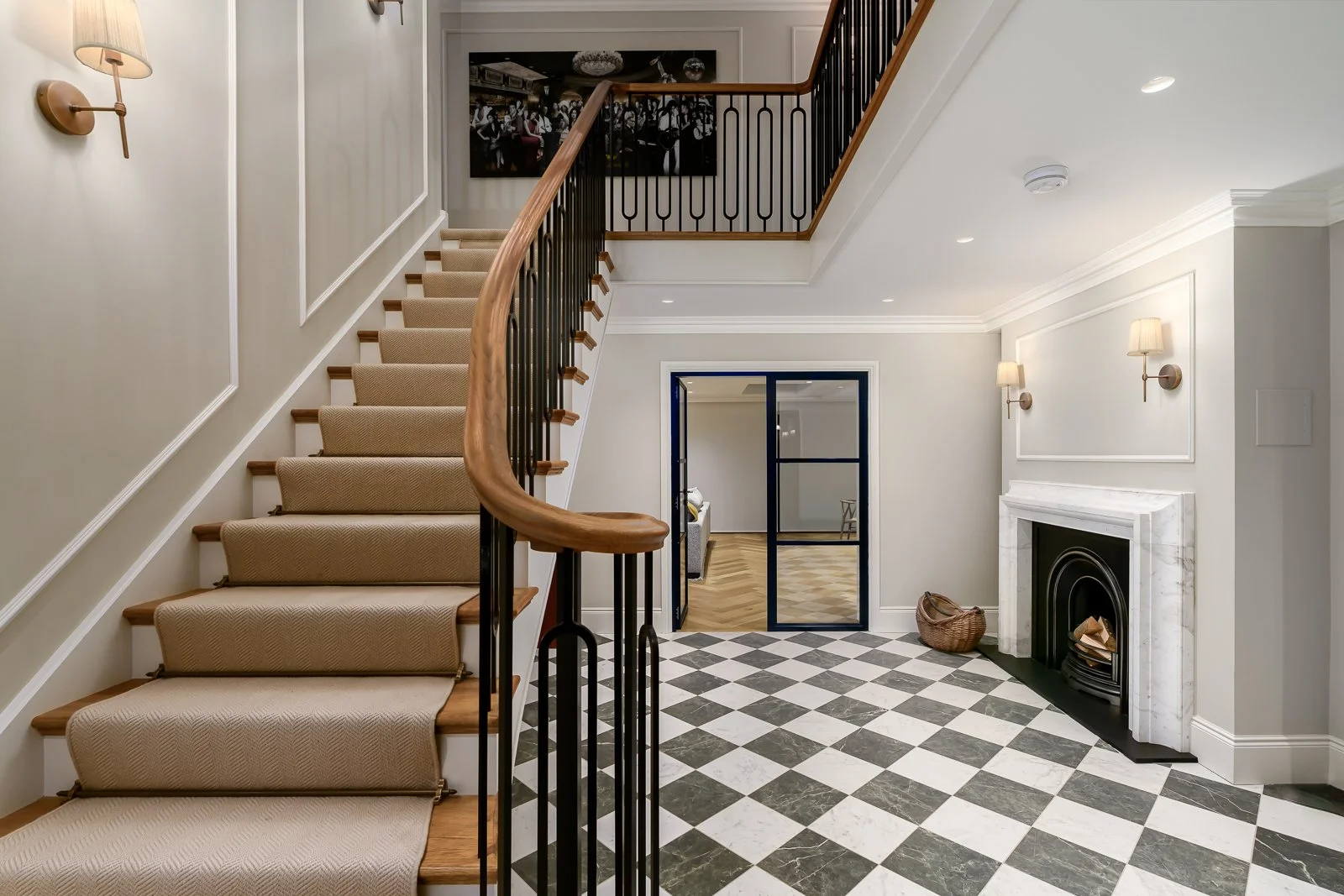 Hallway and staircase detail at Newlands by Rebecca Sudic Interiors, showing patterned flooring, bespoke joinery and the home’s architectural character.