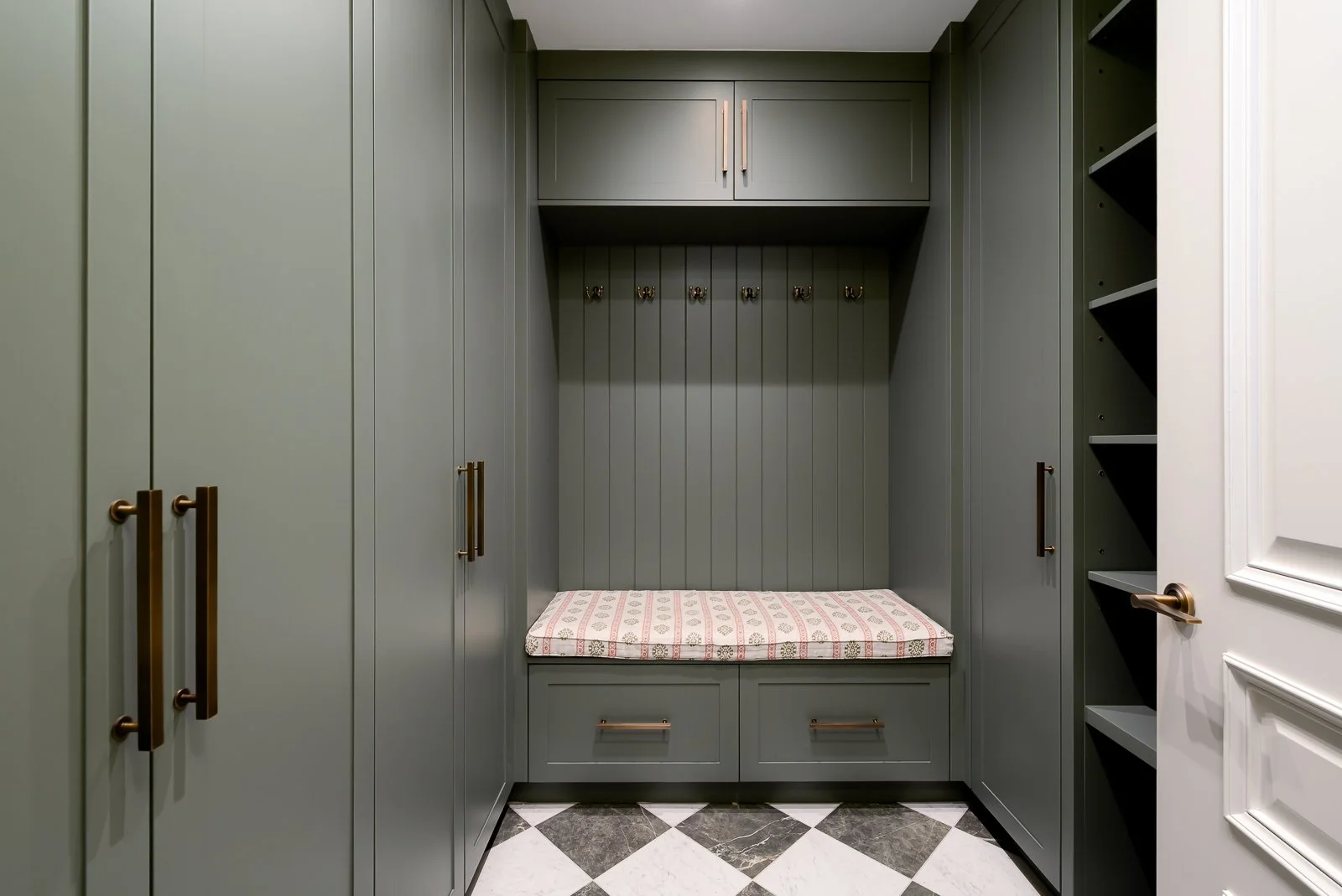 Hallway and staircase detail at Newlands by Rebecca Sudic Interiors, showing patterned flooring, bespoke joinery and the home’s architectural character.