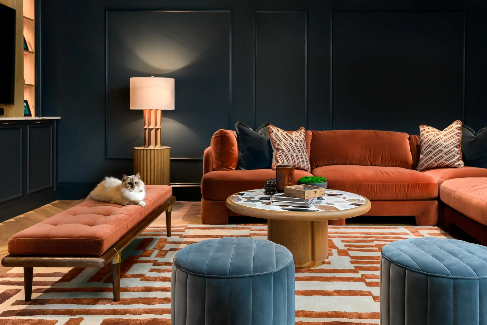 Dark lounge interior at Newlands by Rebecca Sudic Interiors, photographed to show colour, atmosphere, furniture, lighting and lived-in detail.