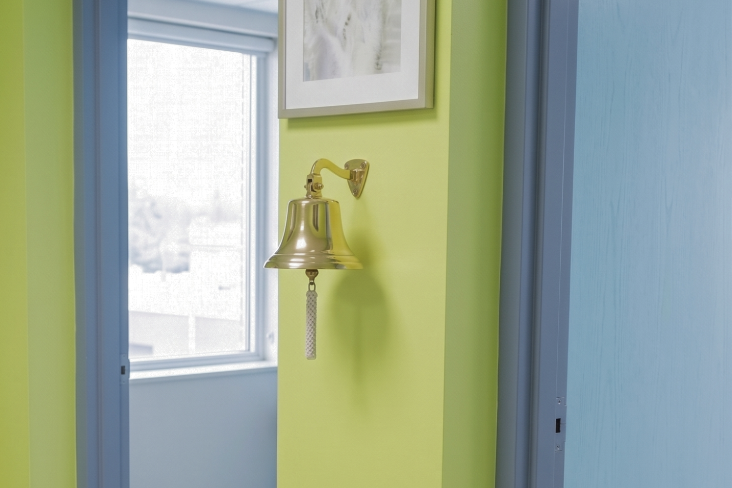 A bell hanging on the wall of a pediatric oncology clinic.