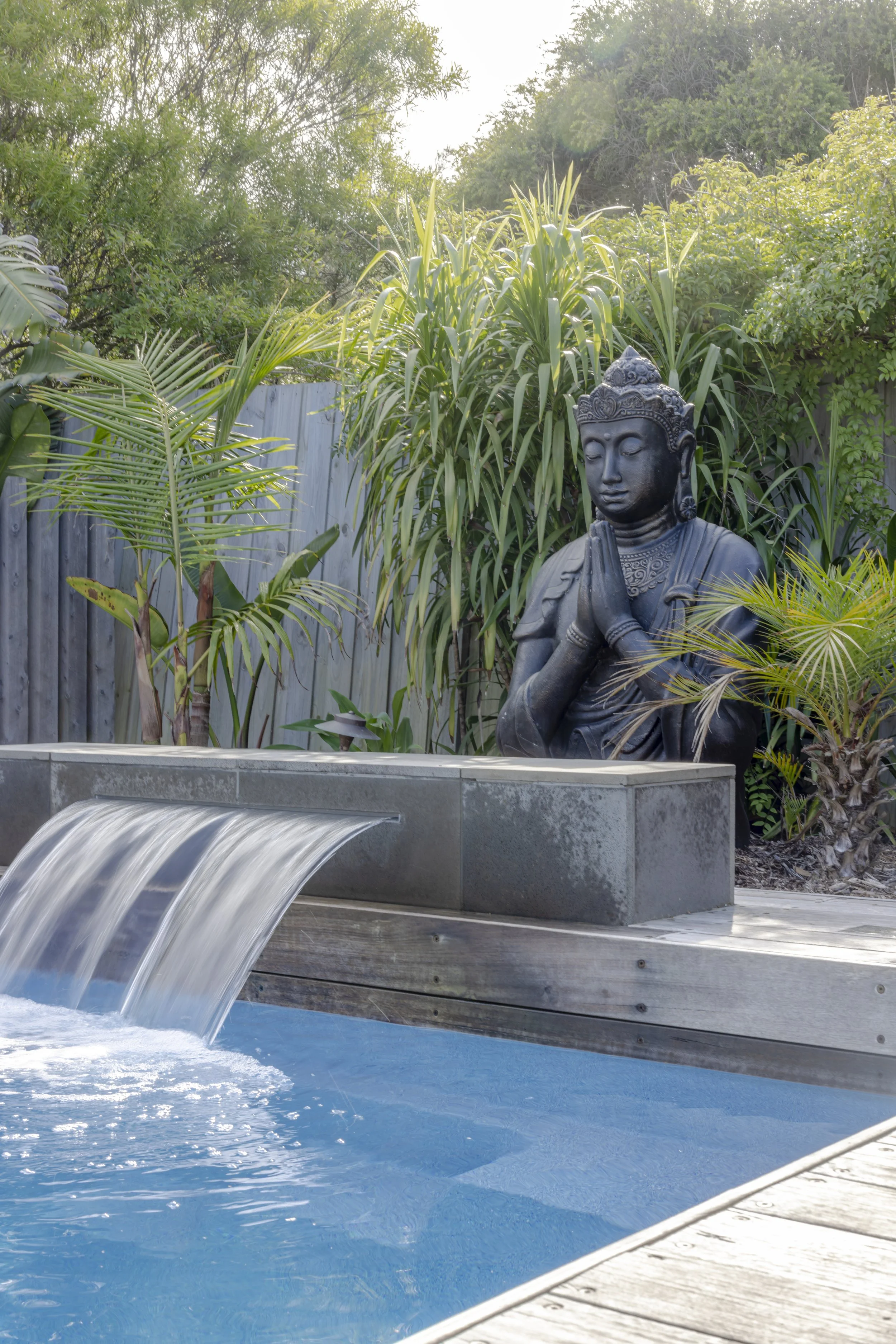 summer-house-retreats-poolside-buddha-statue.jpg