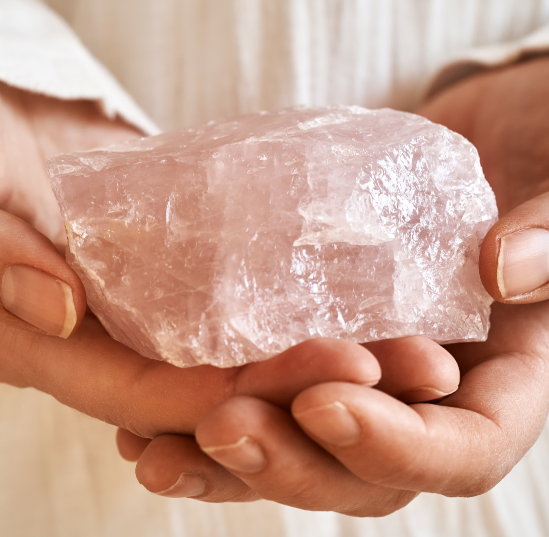 Woman holding rose quartz crystal
