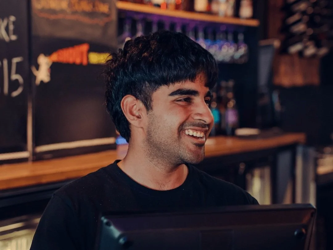 Bartender taking an order during quiz night