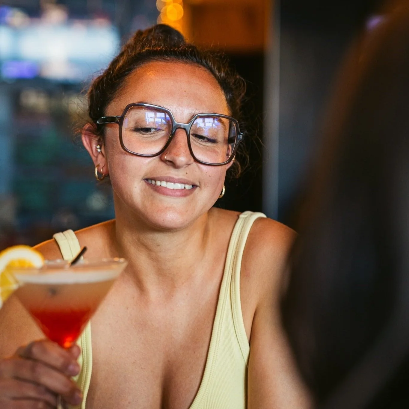 Female customer enjoying her summer cocktail