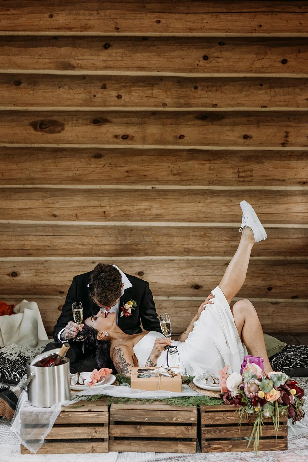 A bride and groom in a wooden hut