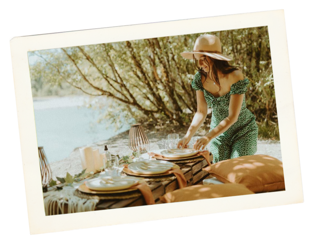 polaroid image of jude douglass setting up a luxury picnic