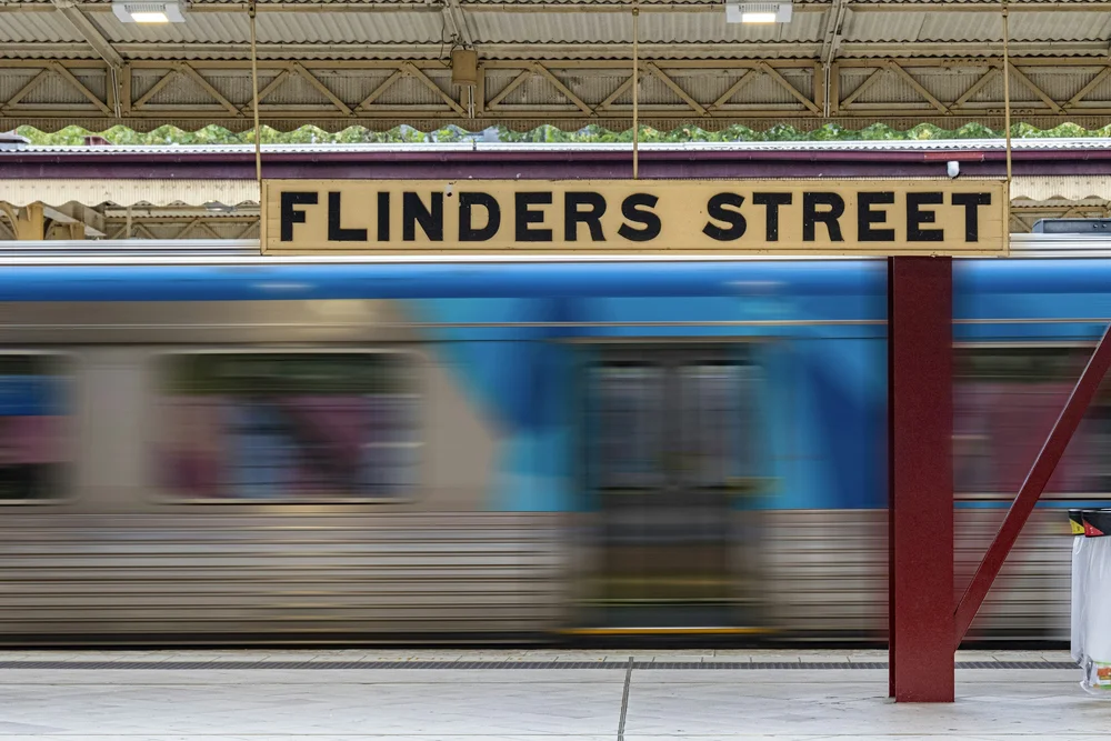 Flinders Street Station with a train passing