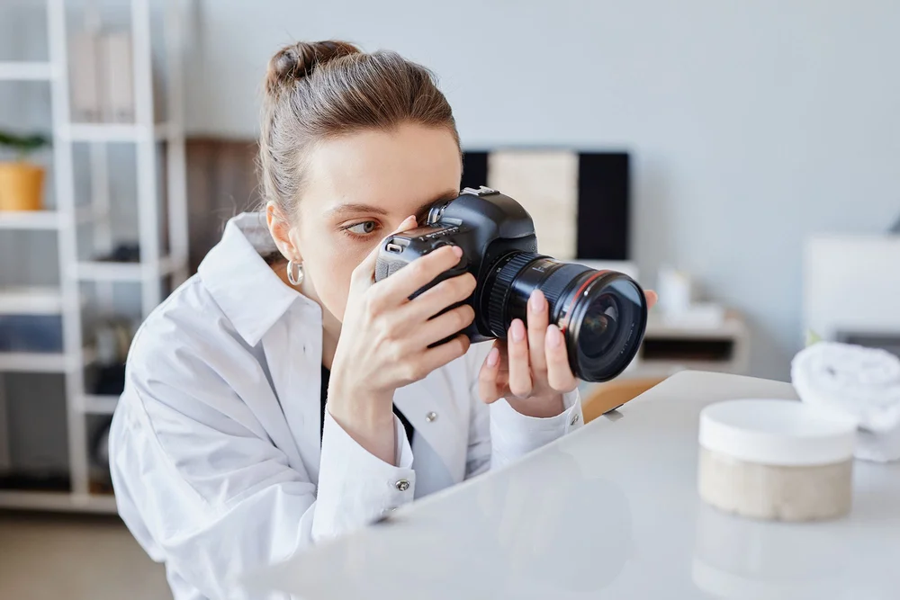 A photographer framing a shot during a lesson