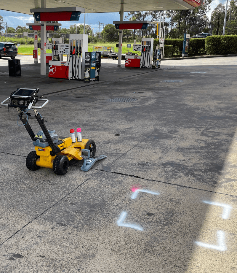 Concrete scanning results and site mark-up showing detected rebar and conduit locations