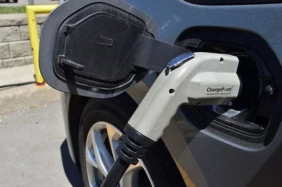 Who pays to charge the car? Canberra apartment blocks grapple with the EV question