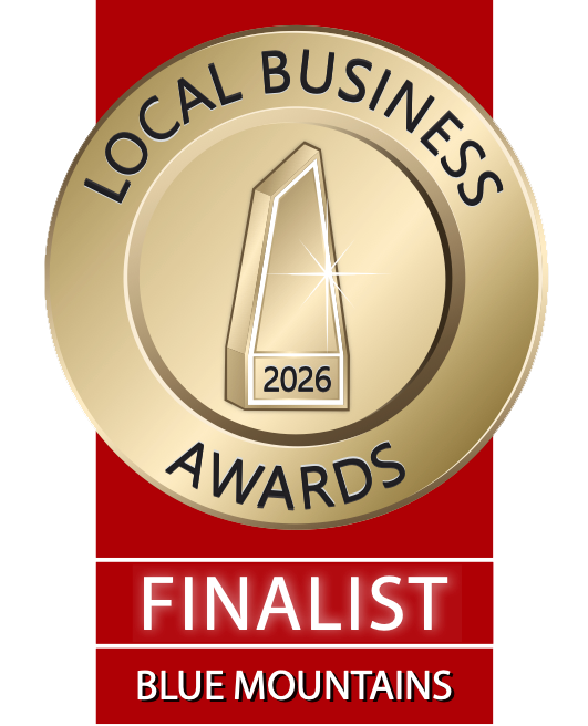 Gold medal badge with black text 'Local Business Awards 2026' and a stylized building in the center. Below, a red banner with white text 'Finalist' and 'Blue Mountains'.