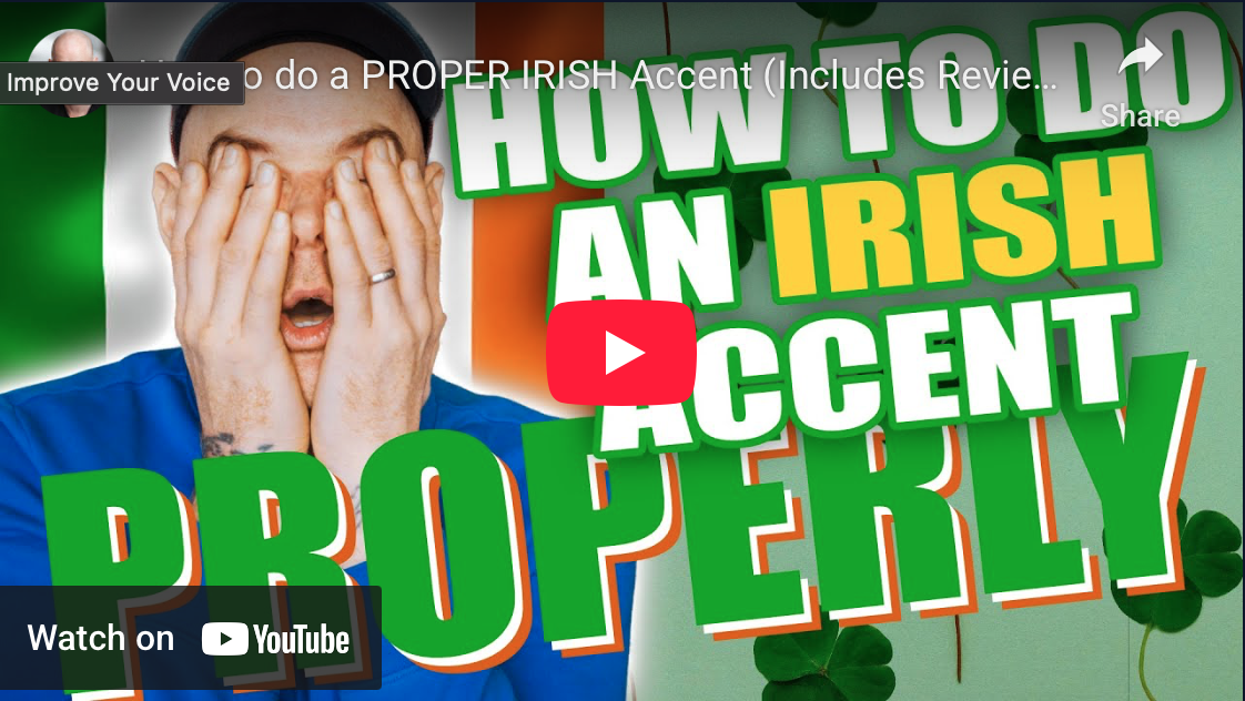 Thumbnail of a YouTube video showing a man with short hair and glasses covering his face with his hands, with Irish flags and shamrocks in the background. The text overlay reads 'HOW TO DO AN IRISH ACCENT PROPERLY.'
