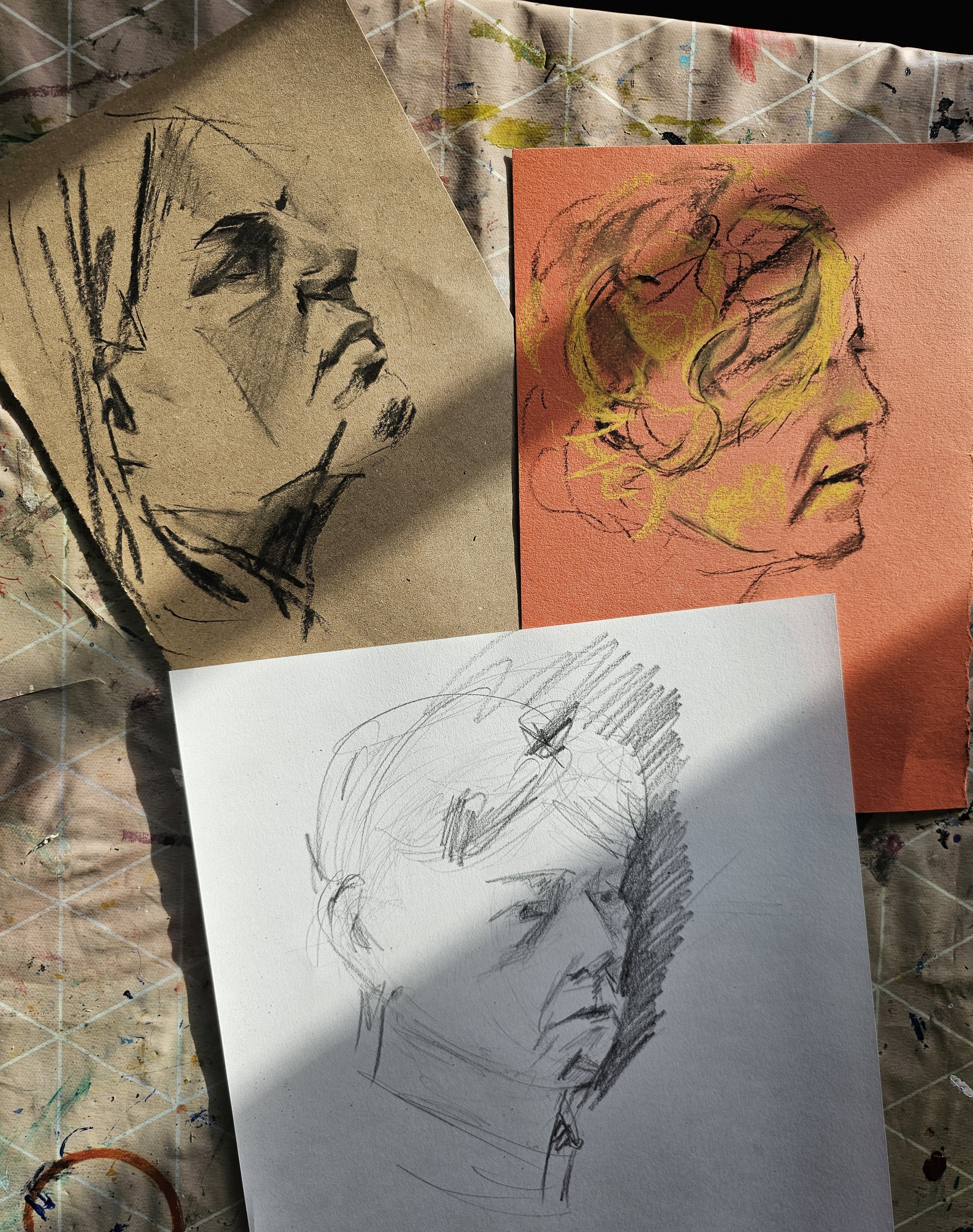 charcoal drawings of peoples heads.jpg