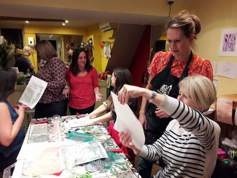 ladies looking at peoples prints.JPG
