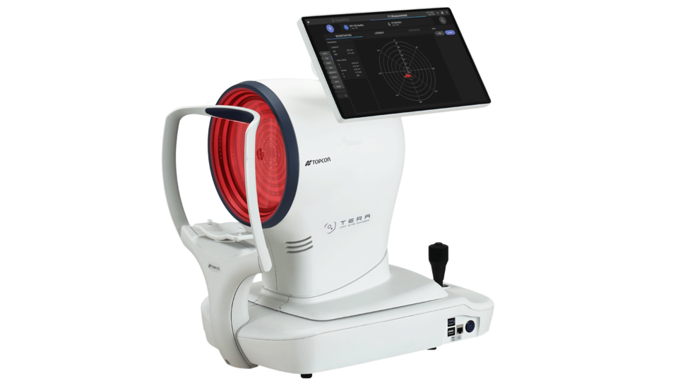 A medical device with a large circular red sensor, a joystick, and a tablet screen displaying data, used for eye or vision testing.