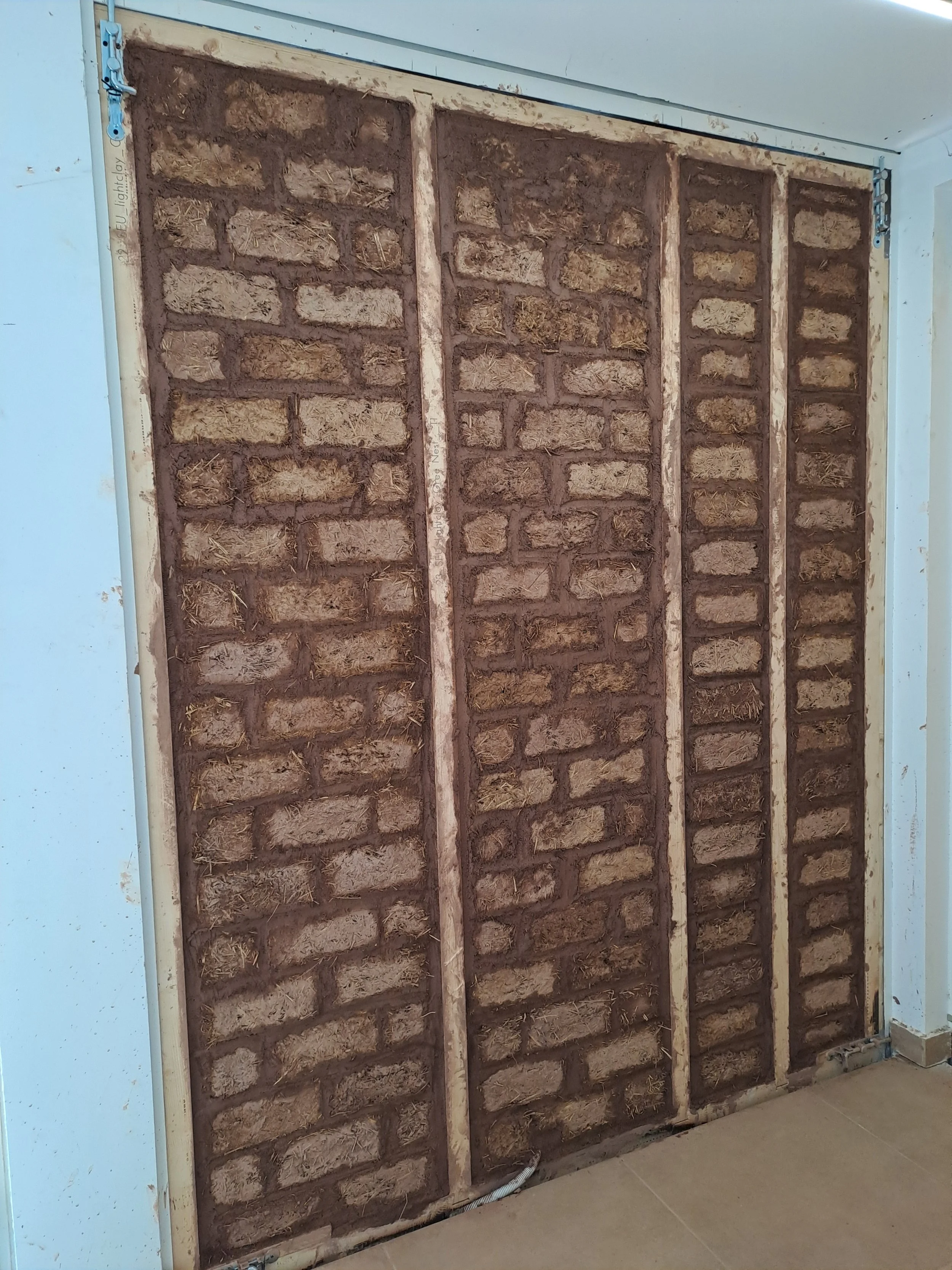 Light clay bricks installation finalized.jpg