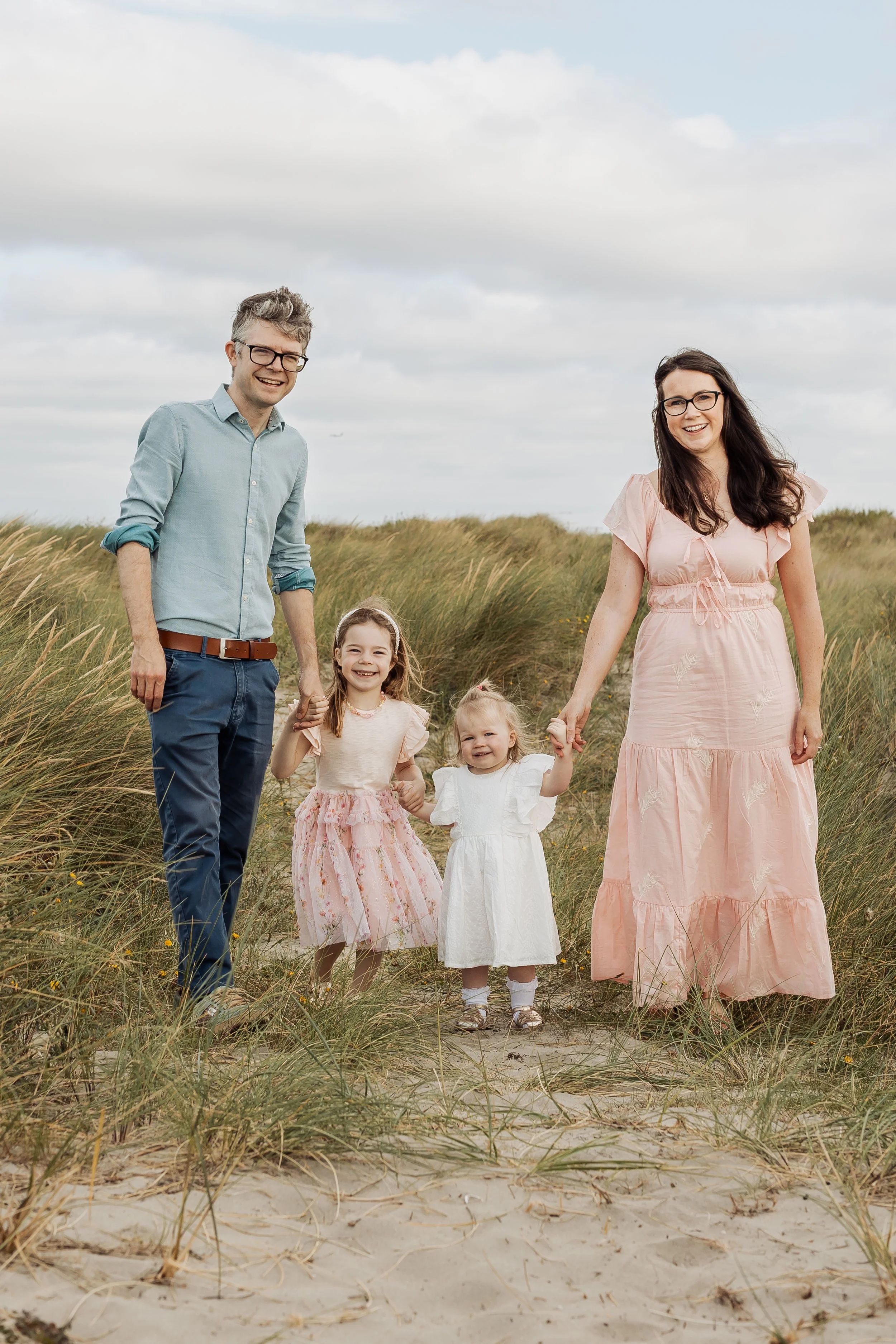 family of 4 smiling during Dublin family photoshoot in BullIsland