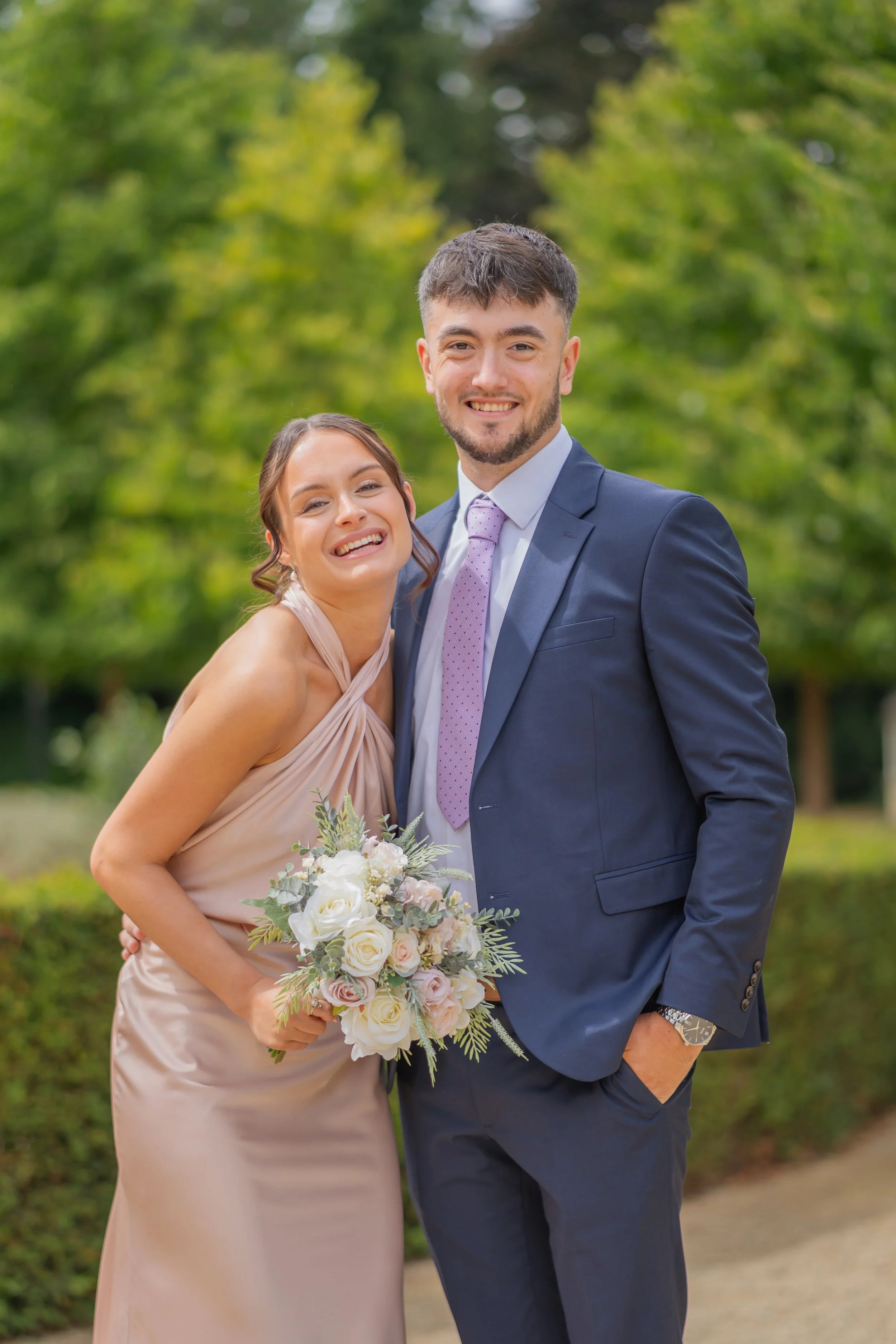 Bridesmaid and groomsman enjoying the wedding celebrations at Sudbury House.jpg