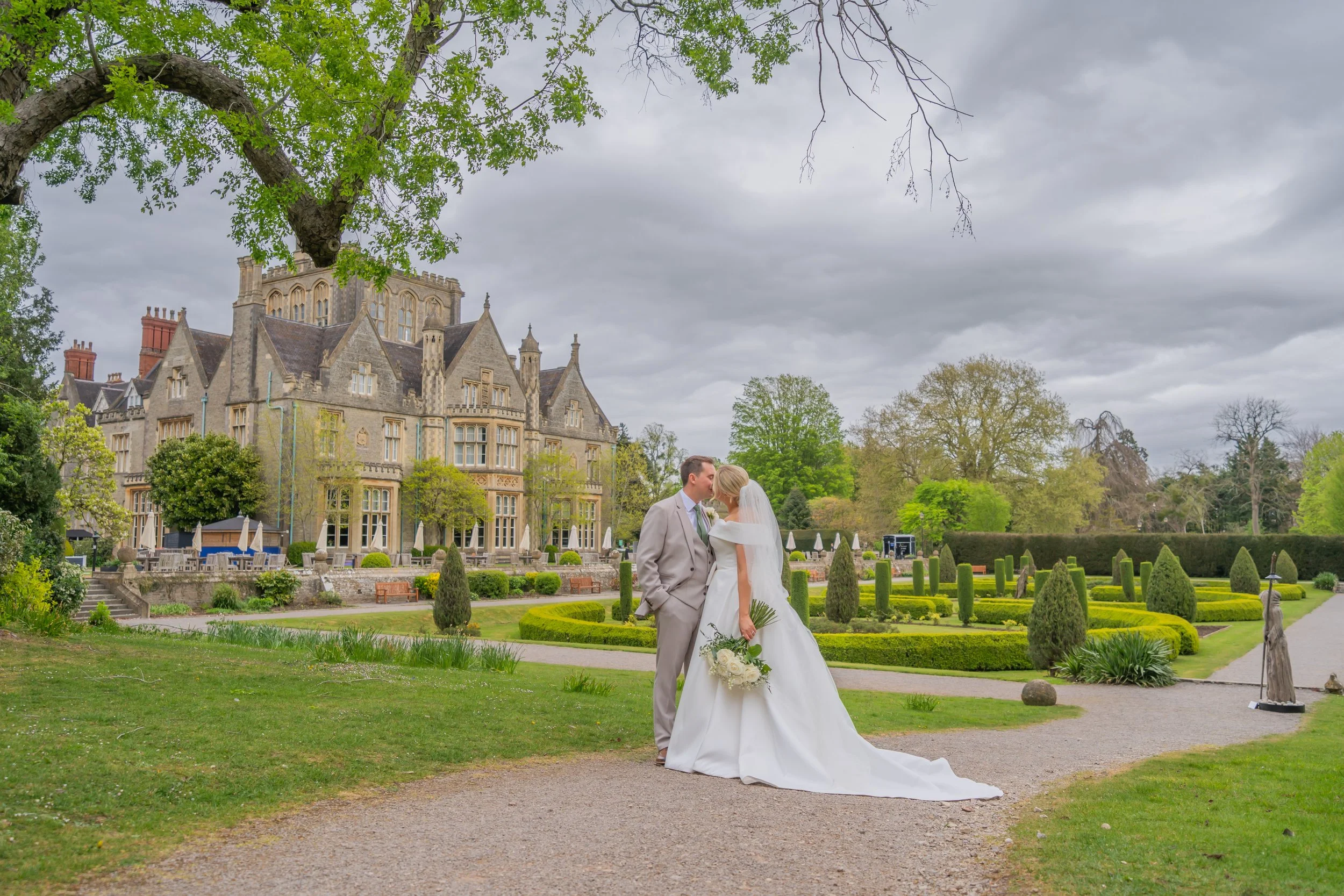 Newlyweds enjoying the beautiful grounds of Tortworth Court.jpg