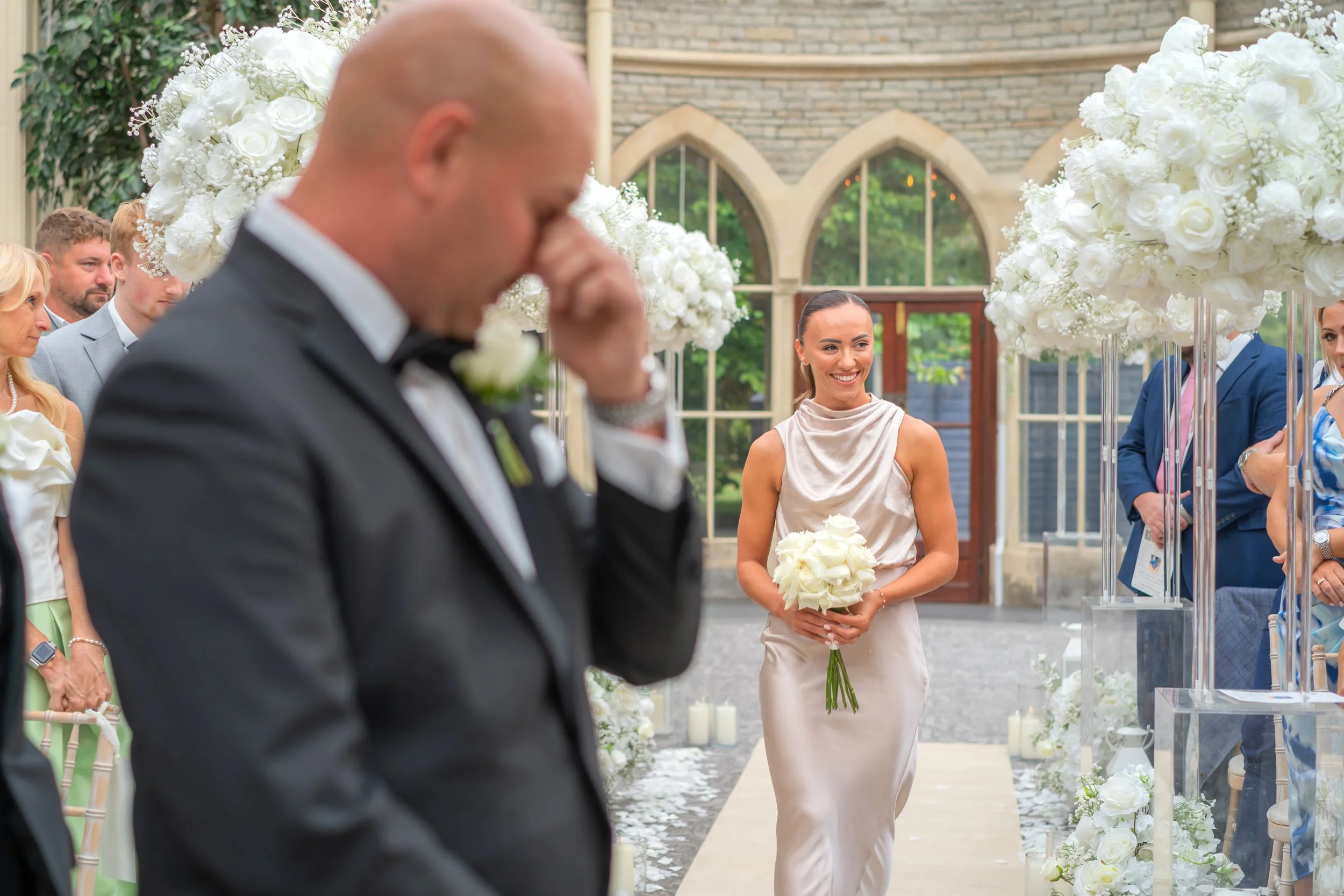 An emotional groom during the ceremony at Tortworth Court..jpg