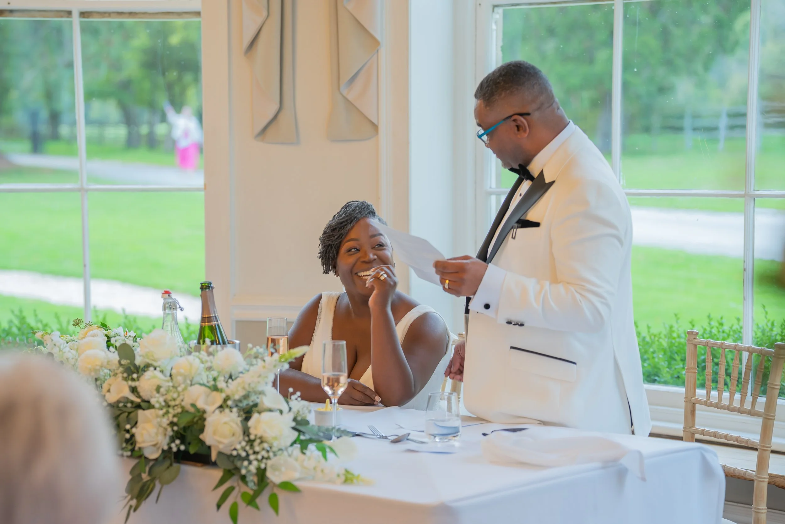 Laughter during the wedding speeches at Eastington Park.jpg