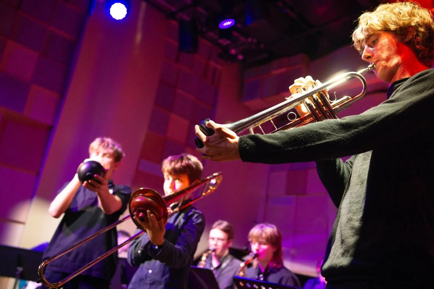 Big band on stage – featured trumpets on stage.