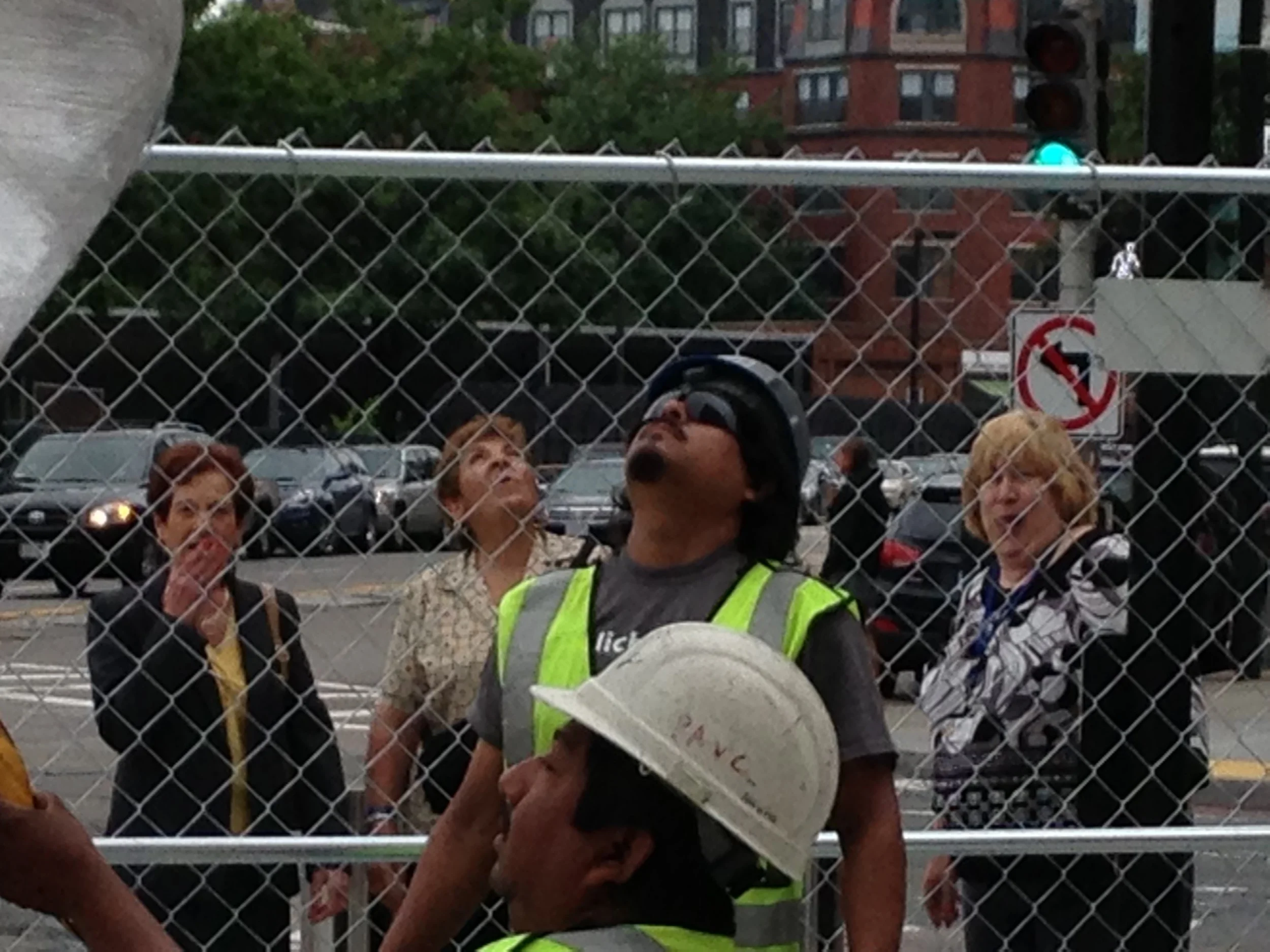 Sal and Rey at work, while the local ladies on smoke break check out the action.