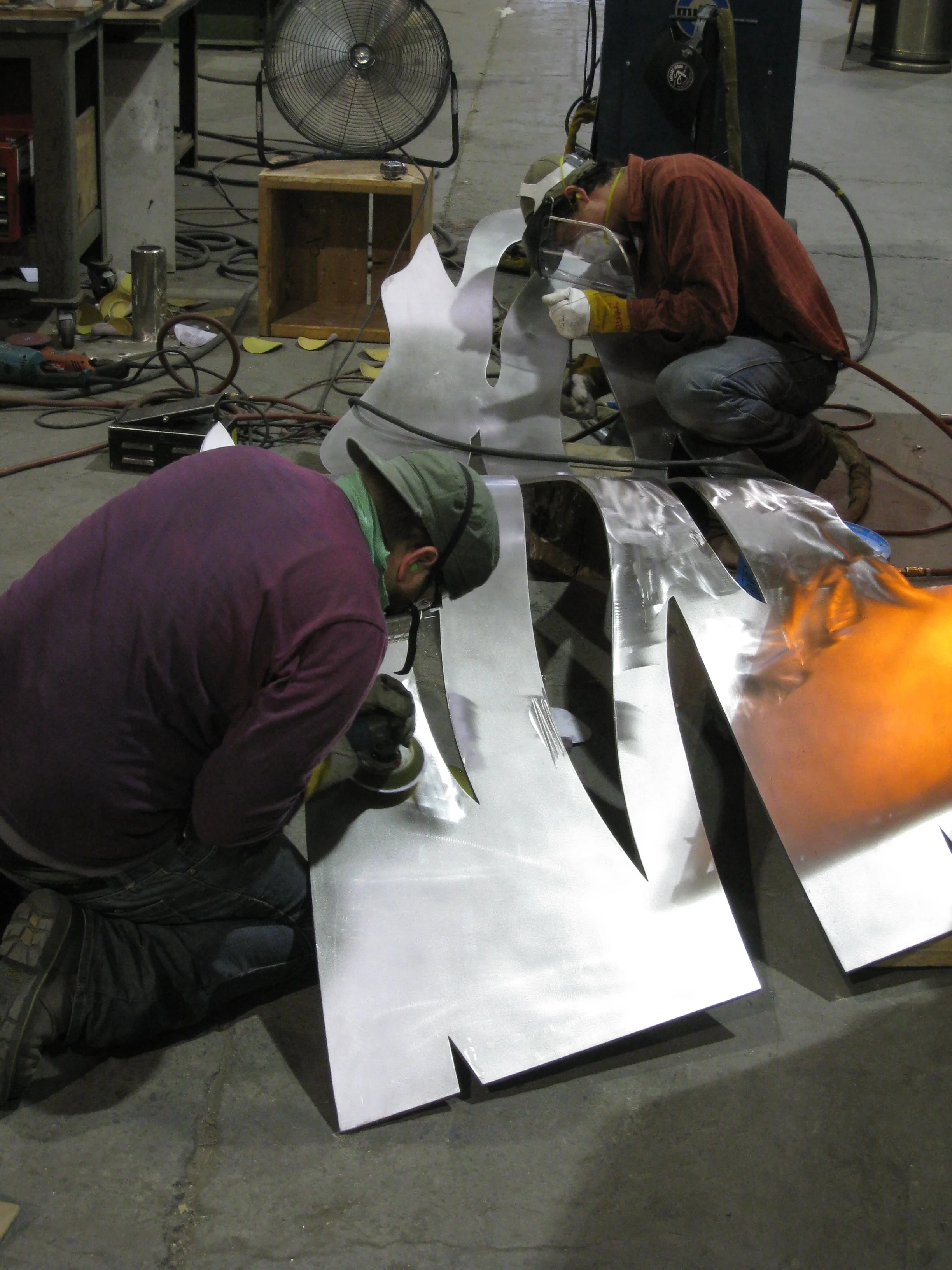 After rolling, the piece gets finished AGAIN. And again. And again! Thanks to Jesse, Ivan and all the people who spent countless hours welding, grinding and sanding UPLIFT so it would be perfect.