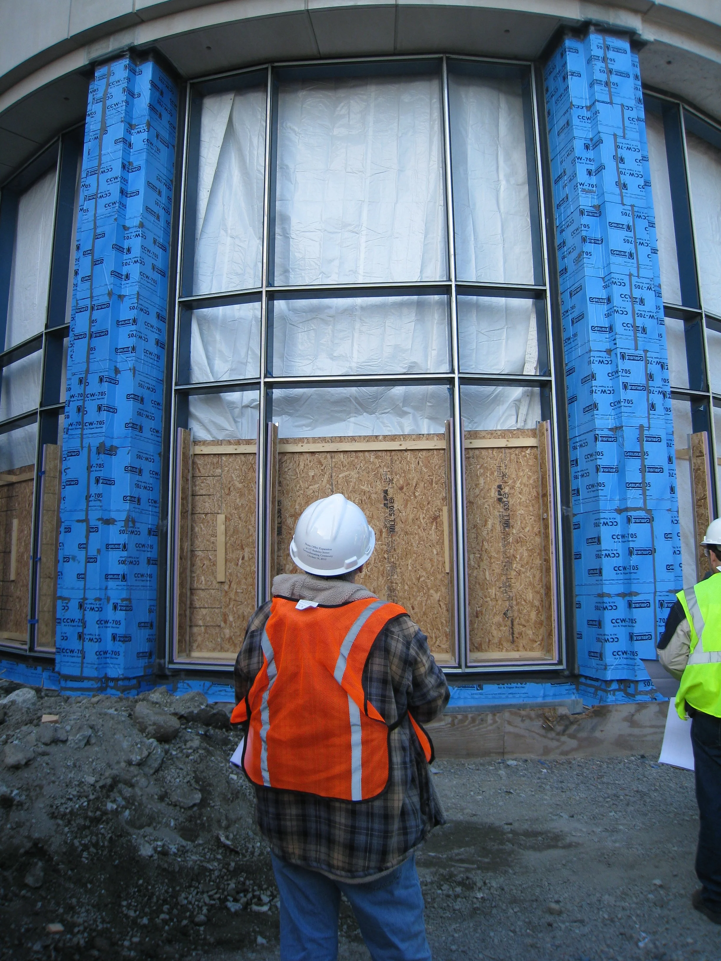 The building before window glass and limestone cladding.