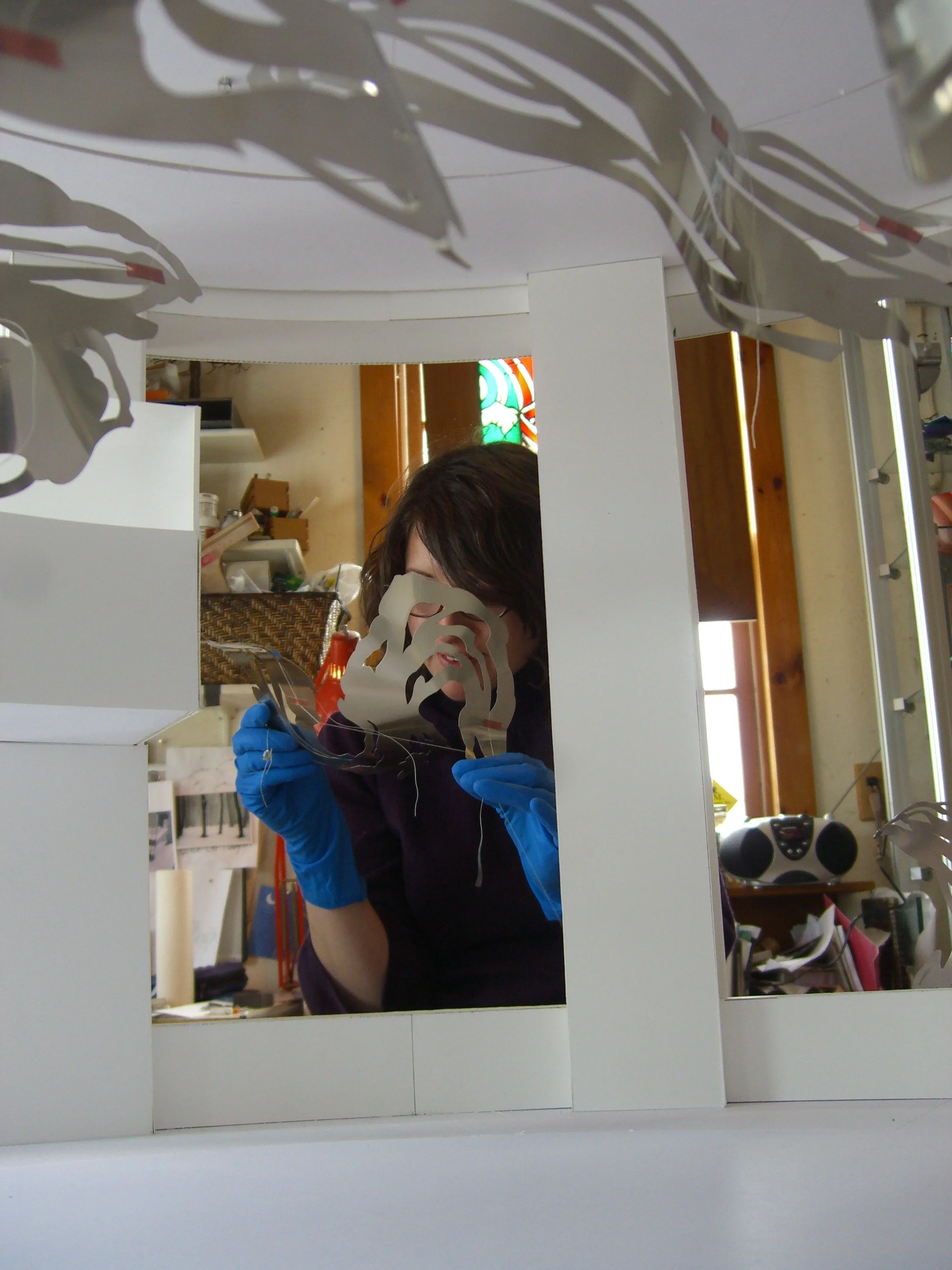 Meticulously repositioning pieces. Funny that we tried so hard to keep the model pristine---it was covered in dirt and Sharpie by the time UPLIFT was finished, after spending months at Polich Tallix and on site at the installation.