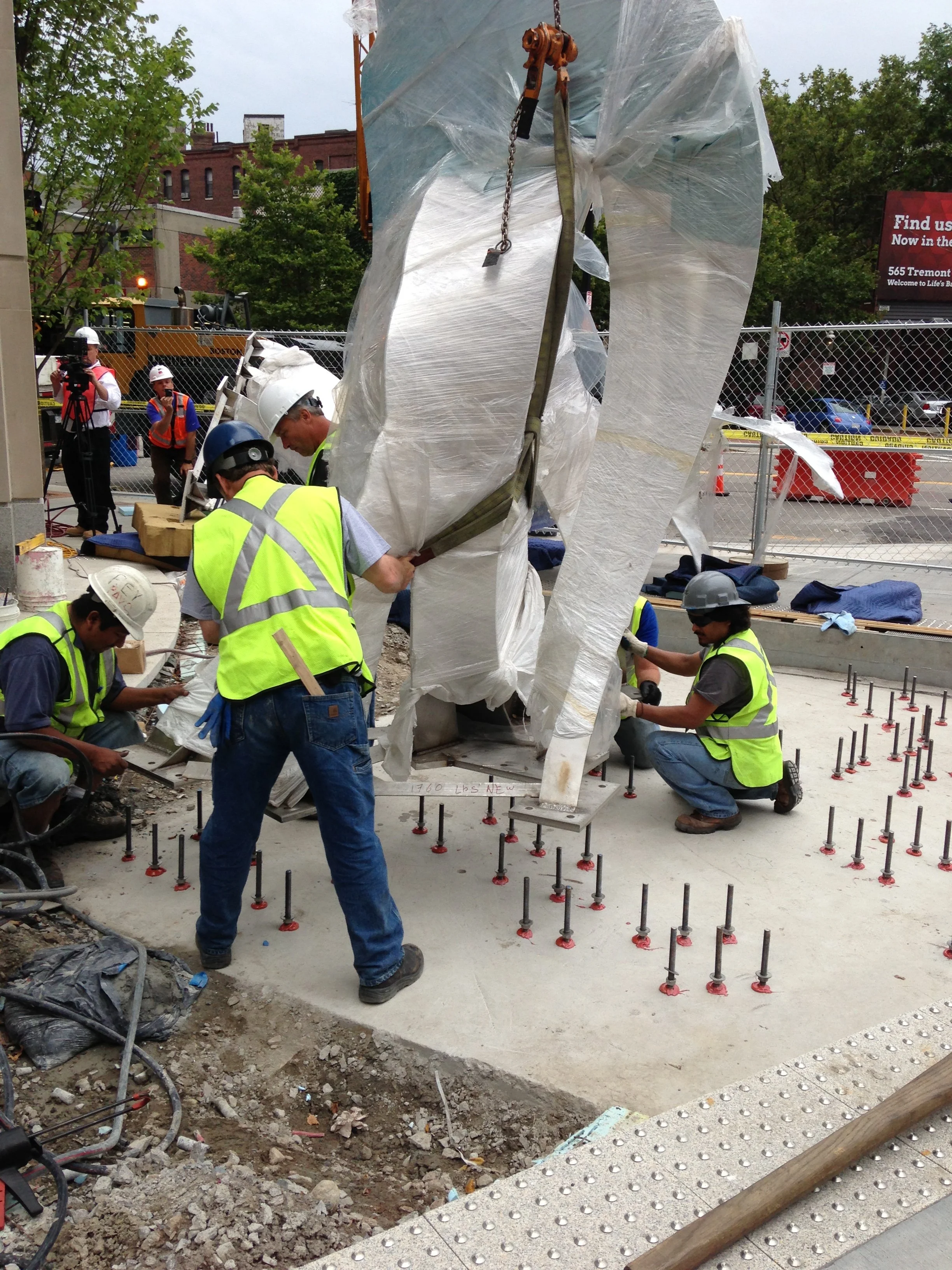 Setting each piece onto 142 steel rods. Each one had to be set in perfectly vertical so that the holes in each base plate would fit. Not one problem! Are these guys amazing or what??