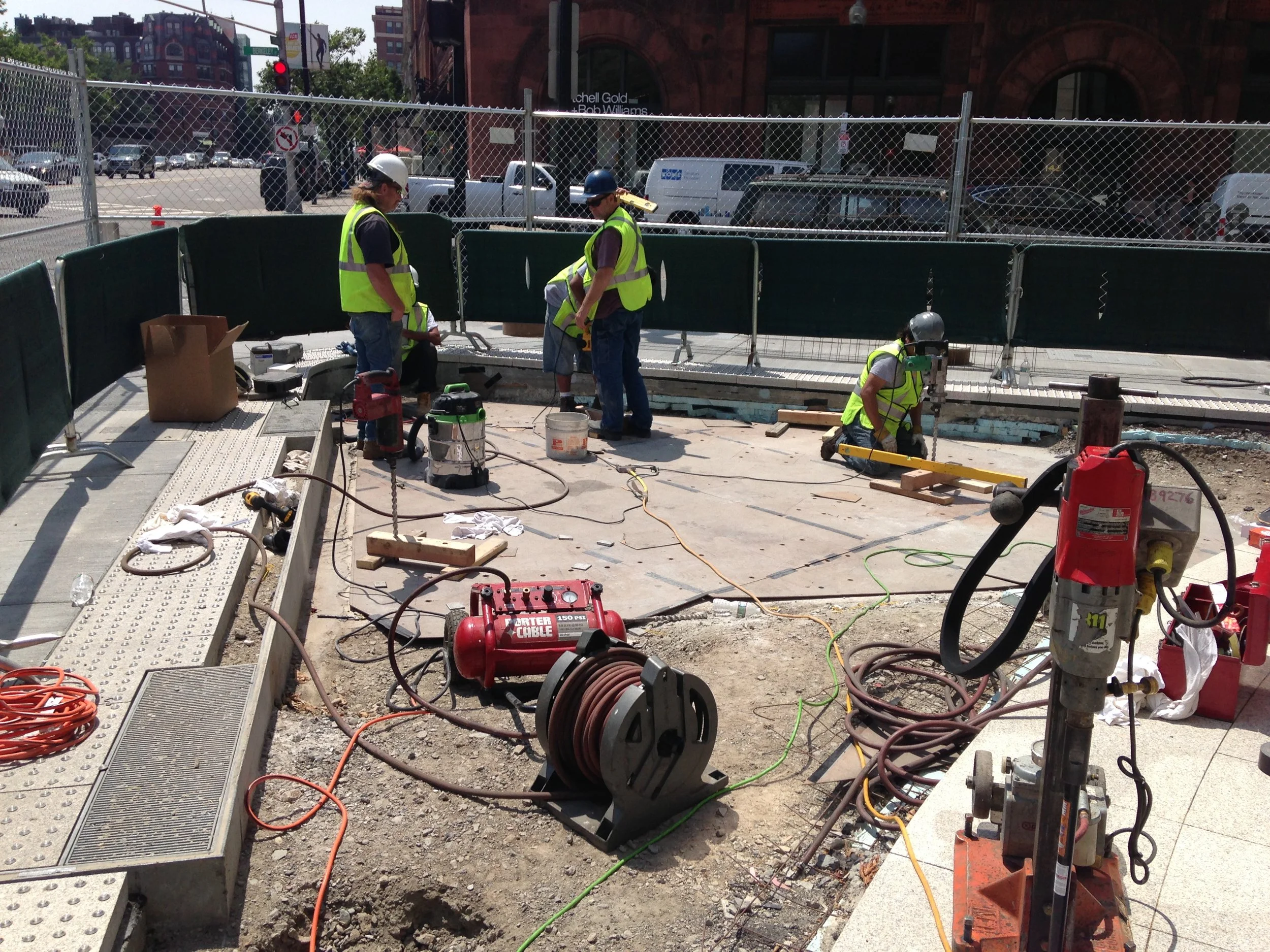 Drilling 142 10-inch holes into a reinforced concrete slab to set the base plates. That would have been hard enough without...