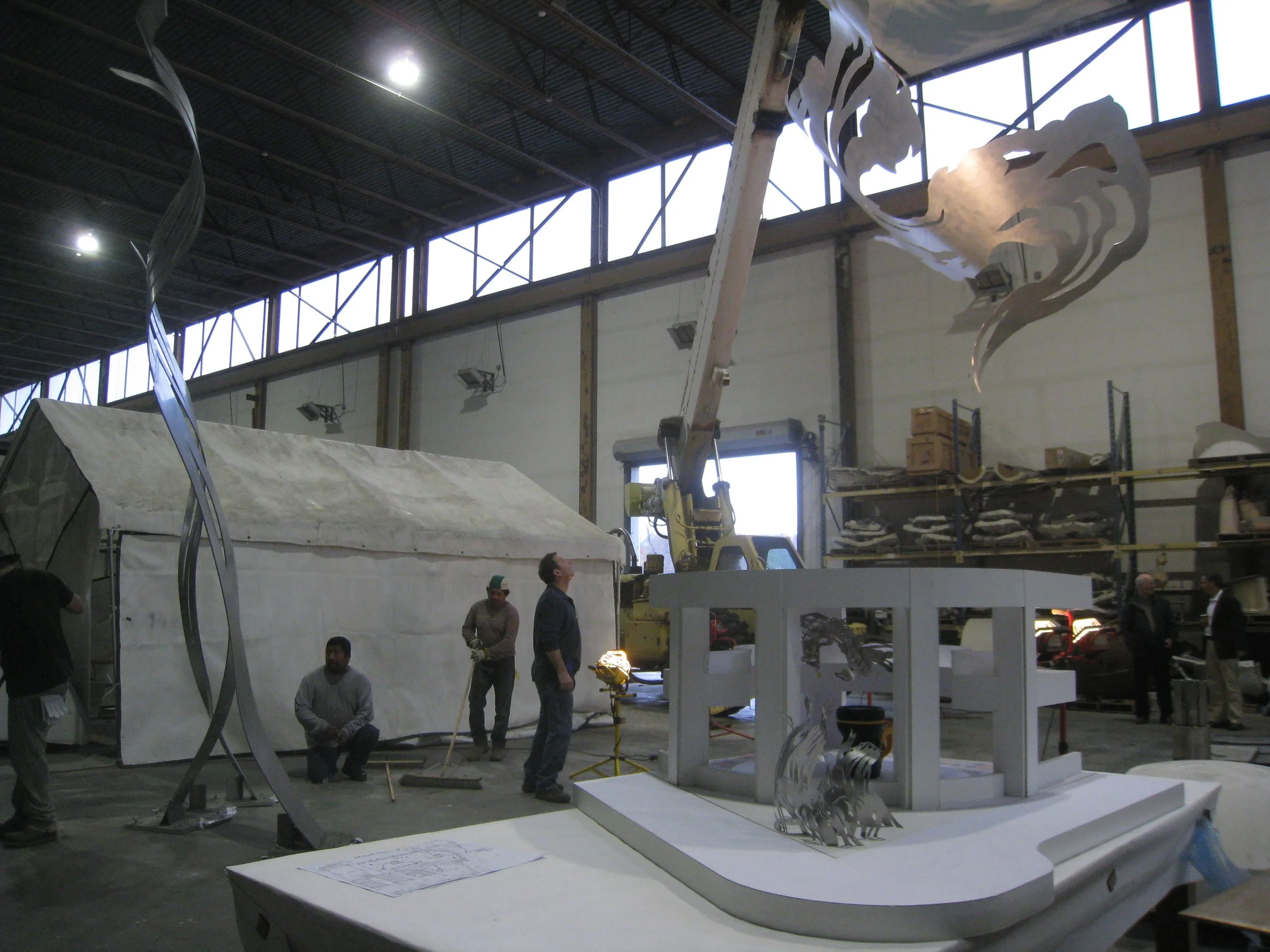 October 2012: the first finished piece in aluminum, and the first exterior piece in stainless steel. You can see the working model in front for comparison.