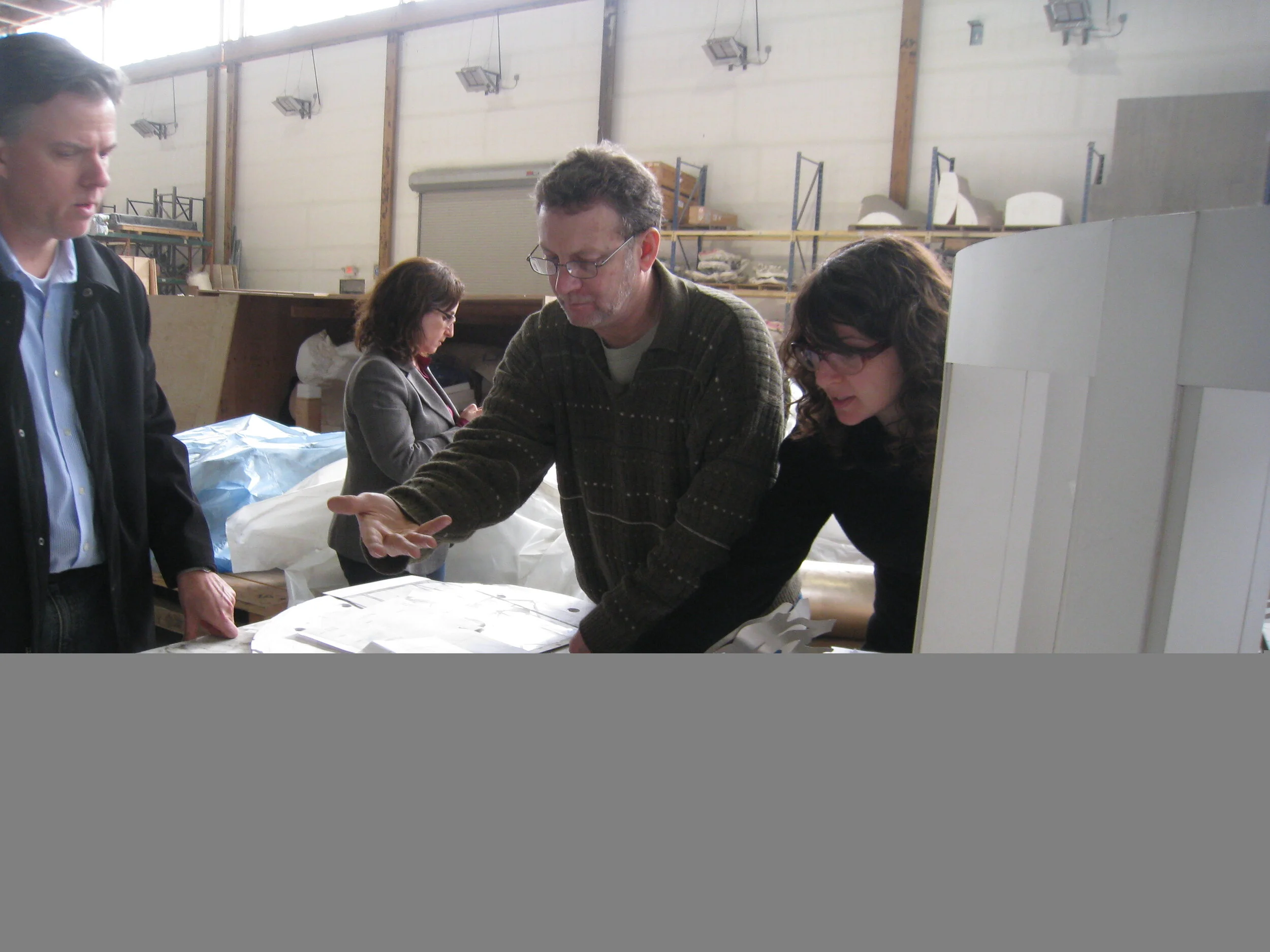Going over ceiling plans. From left, my incredible team: project manager, Kris Collins of Mark G. Anderson Consultants, art attorney Amy Goldrich of Cahill Partners, Mike List of Polich Tallix. Saying "I couldn't have done it without them" is the und