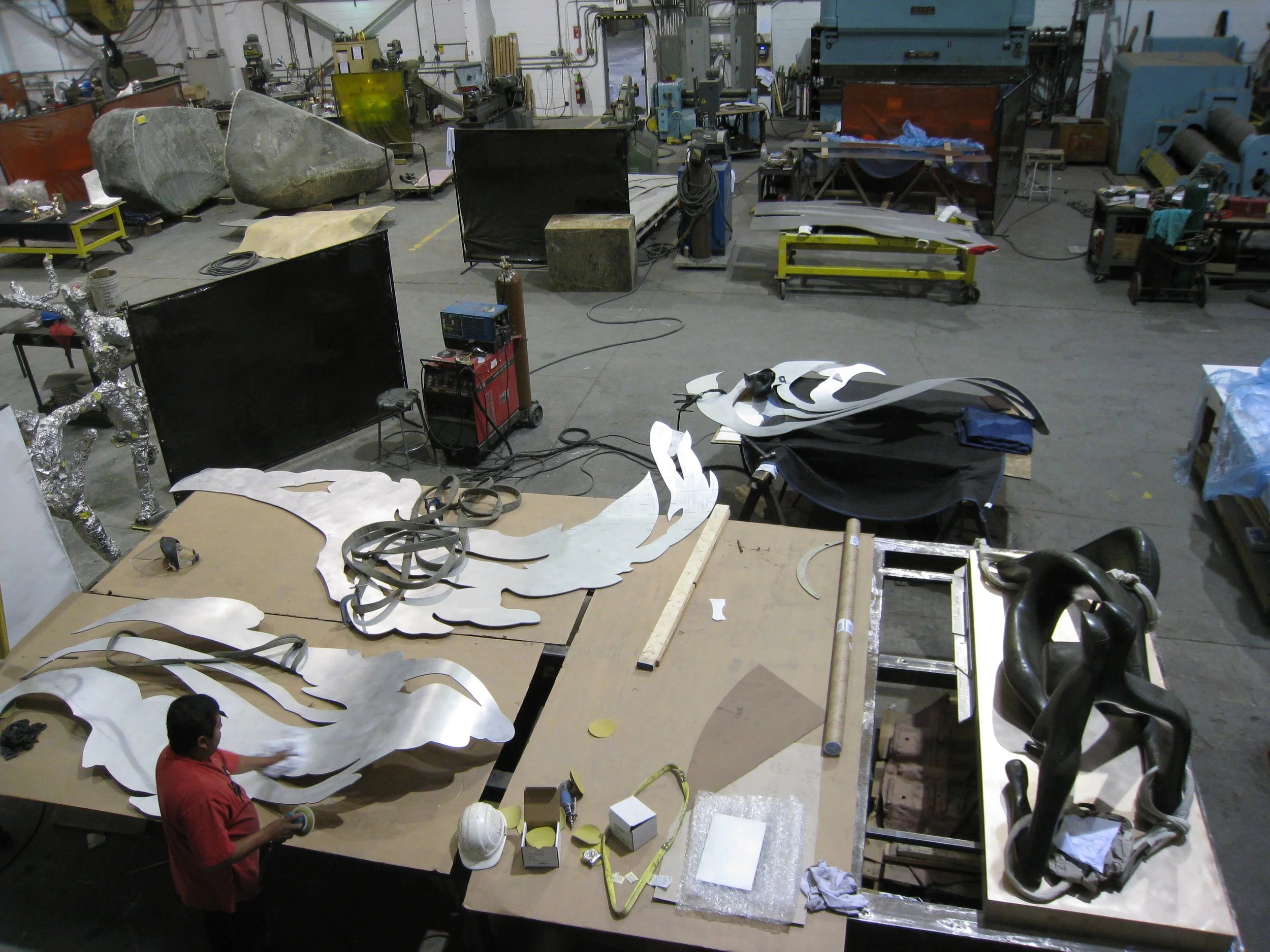 Each piece was cut into smaller pieces in order to roll all the curves, then welded back together and refinished.