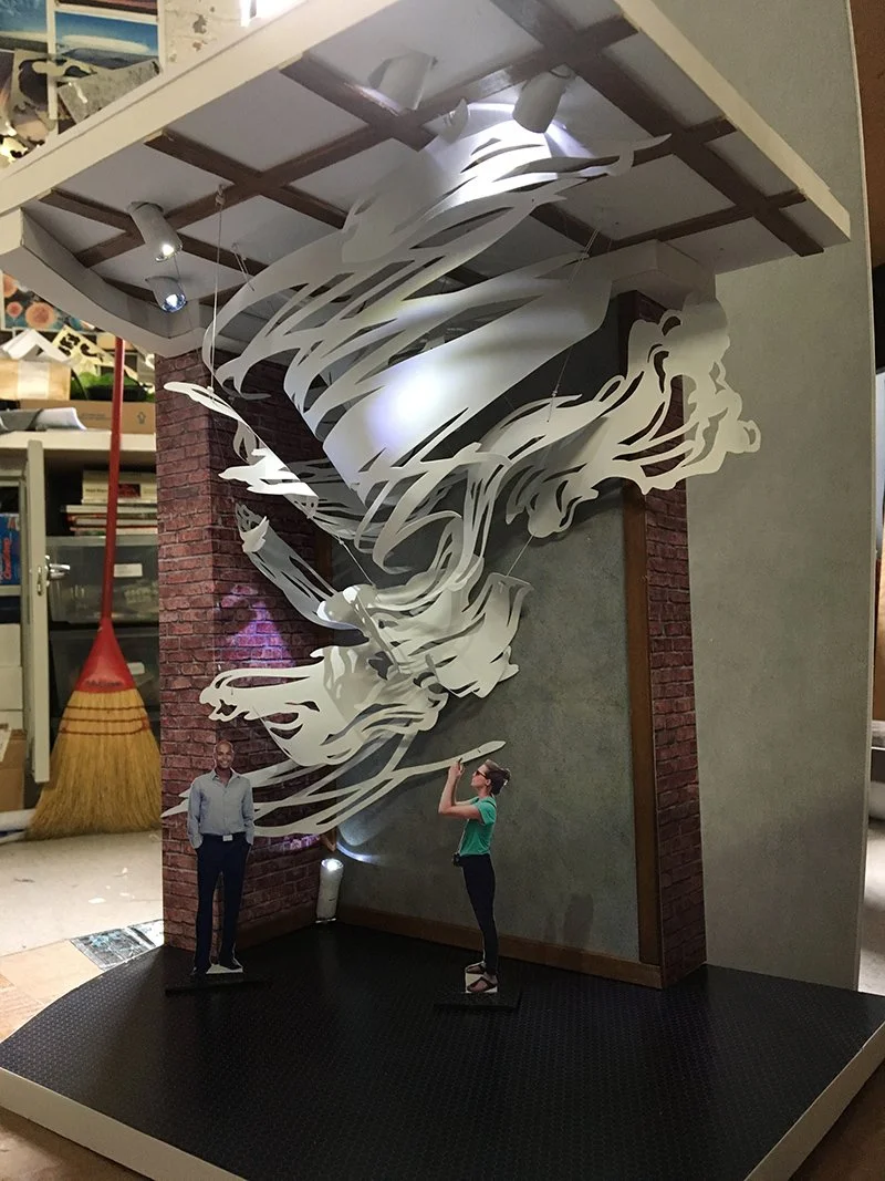 Here's the fancy new model on the floor of my studio with actual lighting! Spray-painted keychain flashlights make great model-sized track lights.