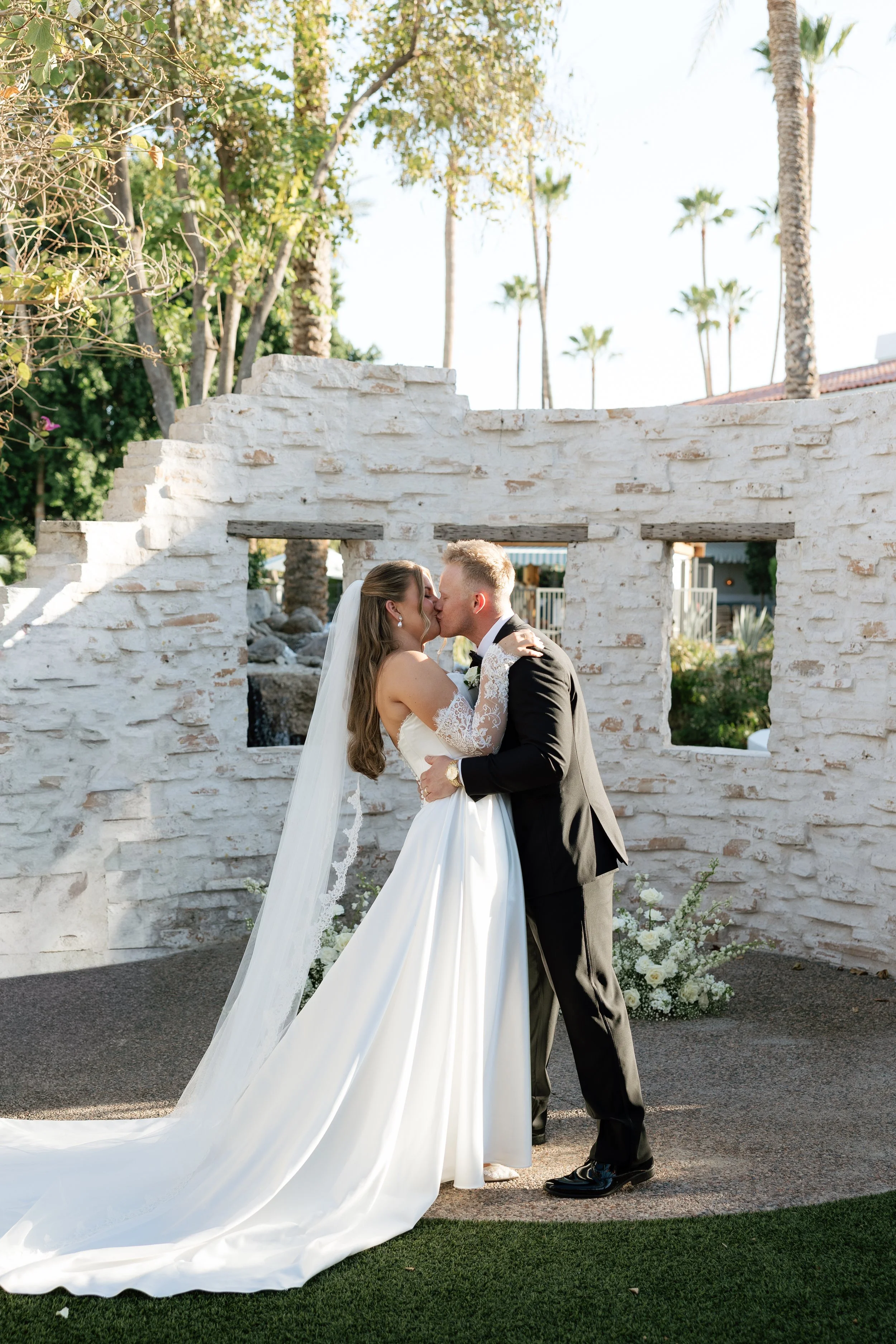Bride and groom sharing their first kiss at The Scott Resort & Spa wedding in Scottsdale, Arizona