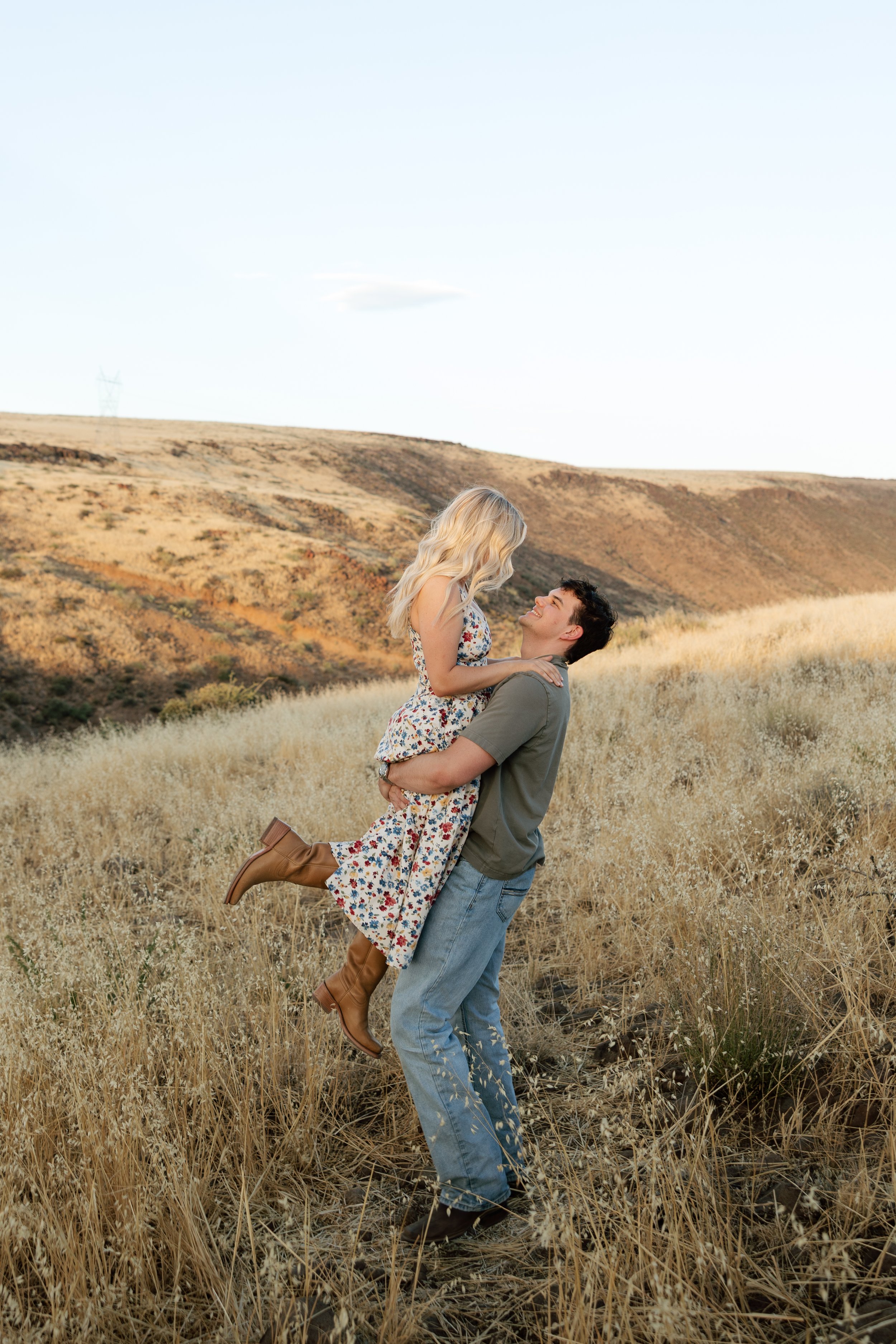 Sunset engagement session in the Arizona countryside with sweeping landscape views