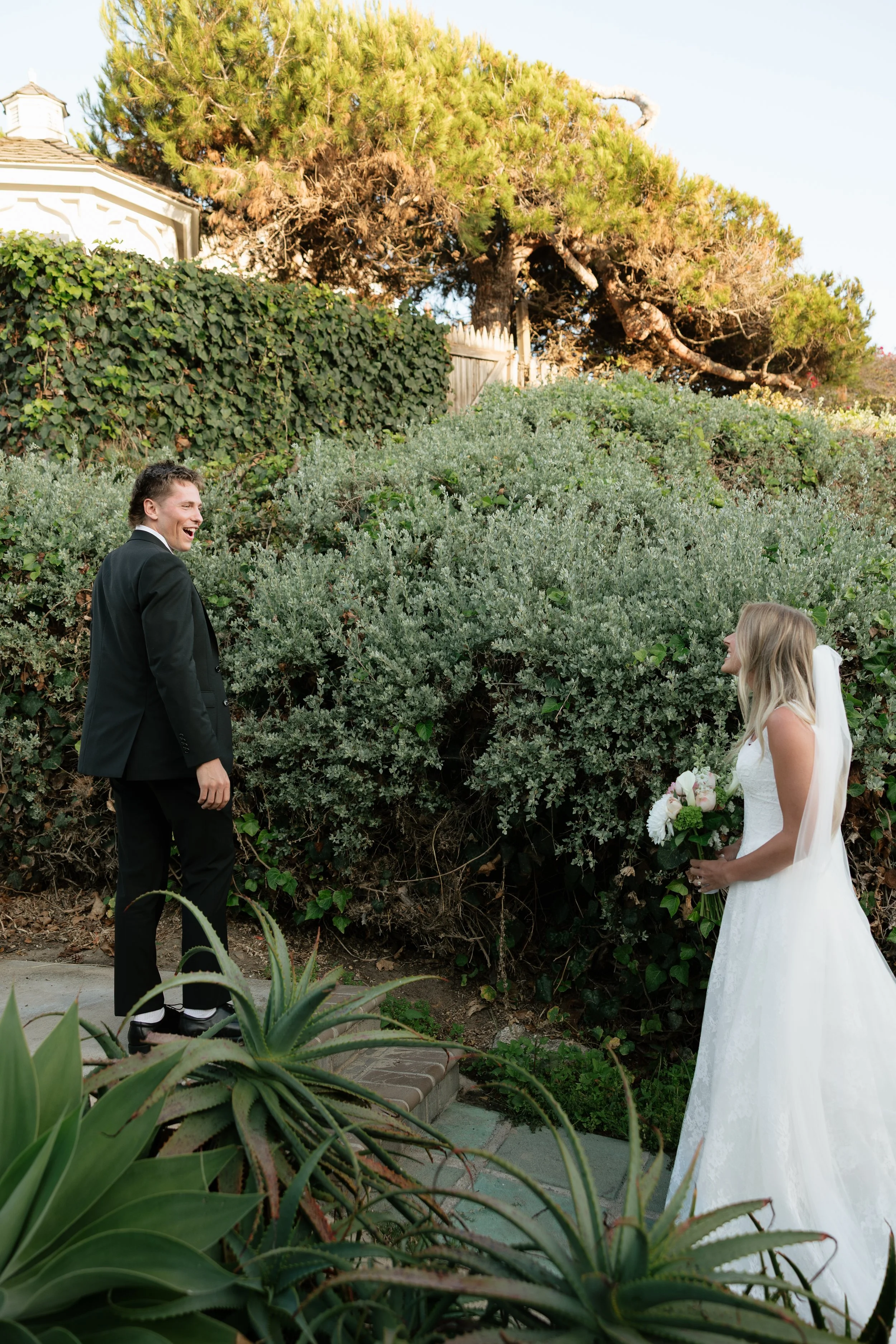 groom reacting to seeing bride for the first time during their wedding in laguna beach california