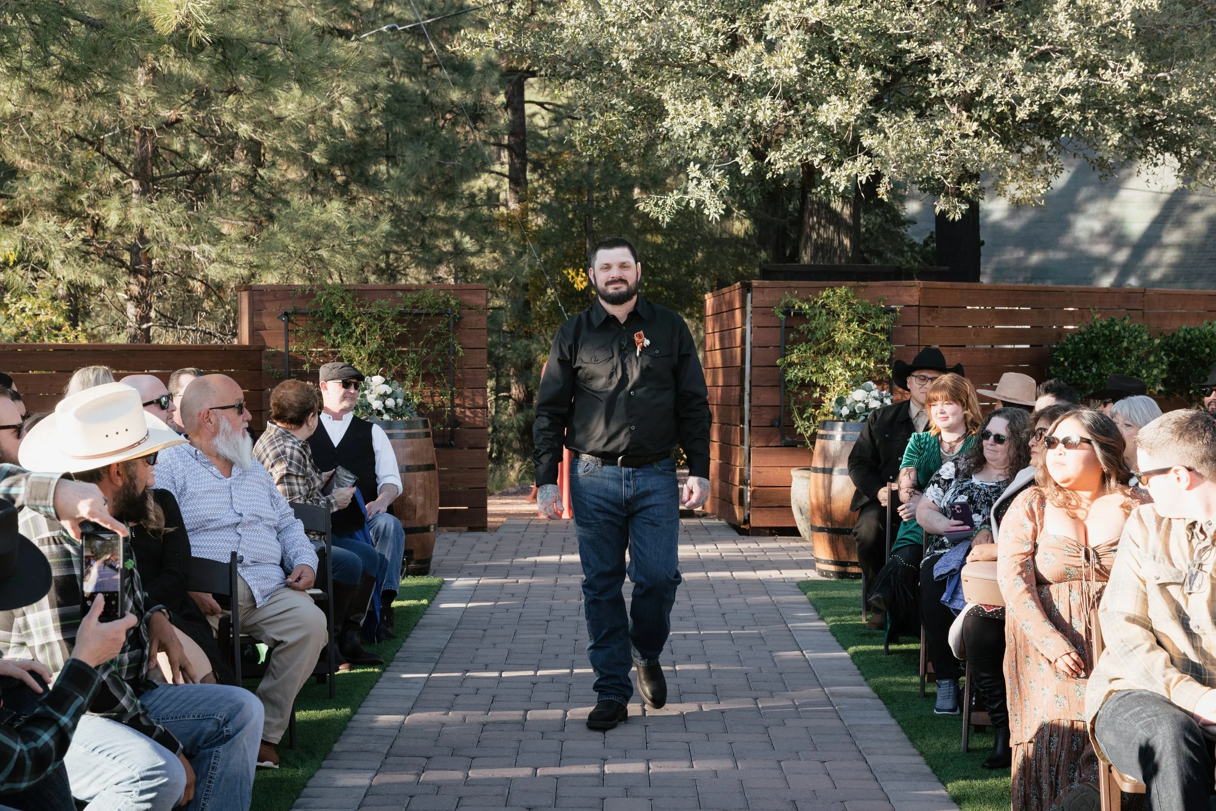 groom walking down the aisle of the ceremony at cabins on strawberry hill