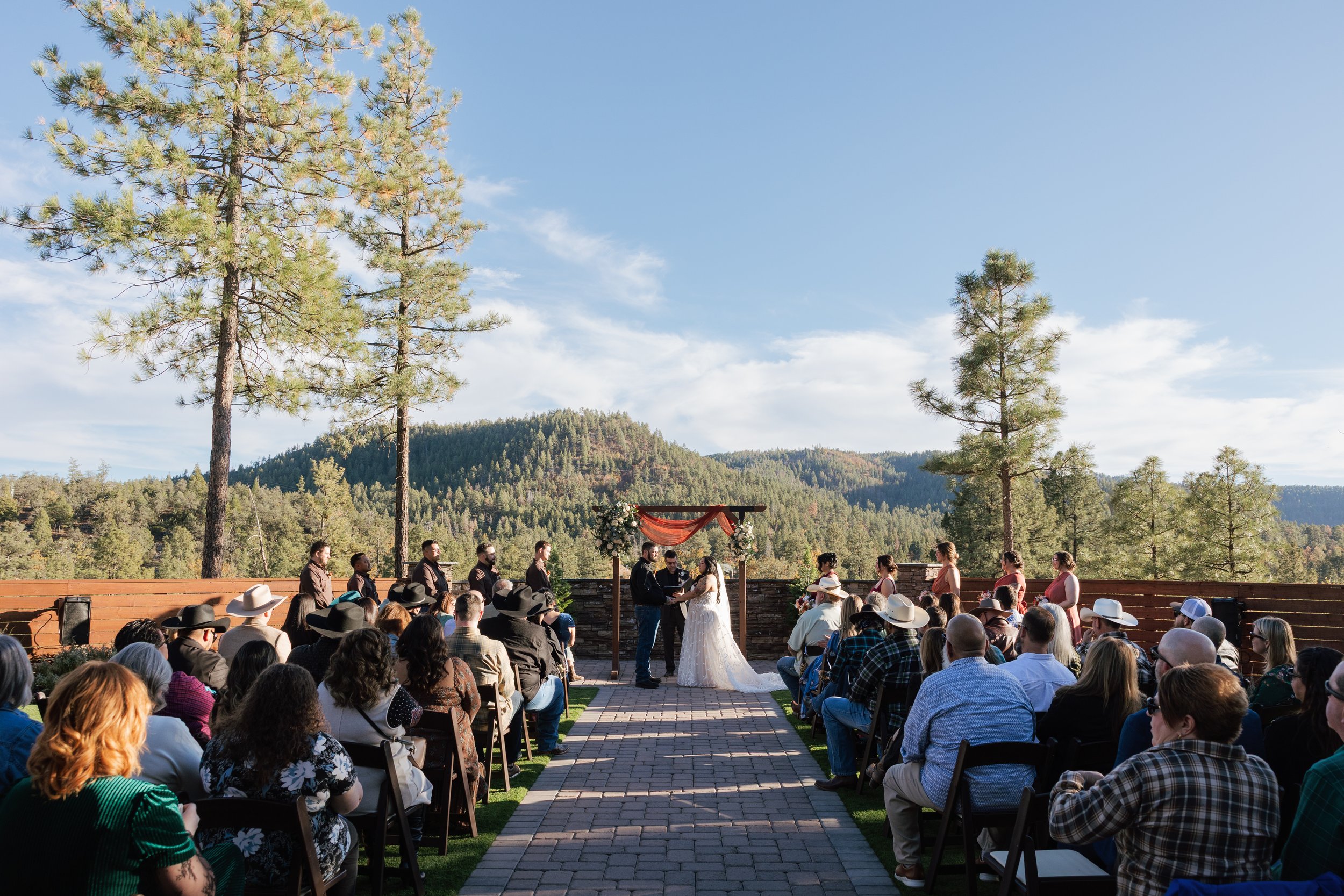 wedding ceremony overlooking mountains covered in pine trees in strawberry arizona