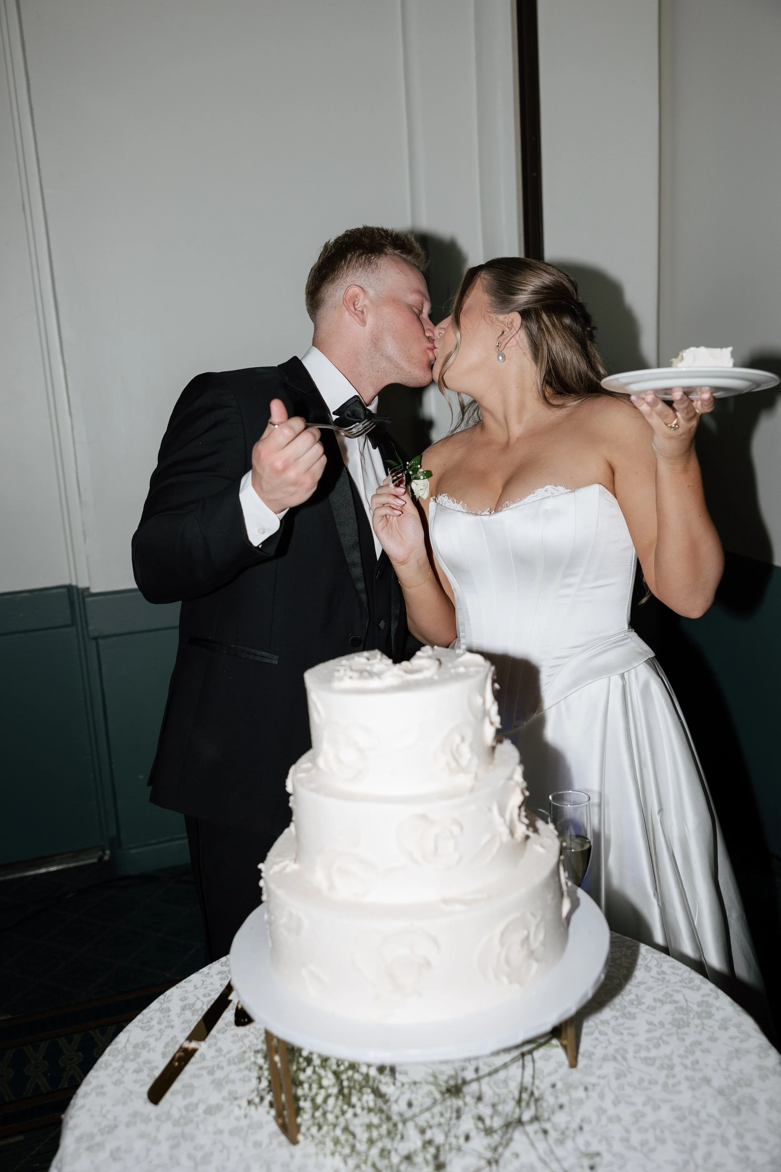 Bride and groom cutting their wedding cake at The Scott Resort & Spa in Scottsdale, Arizona