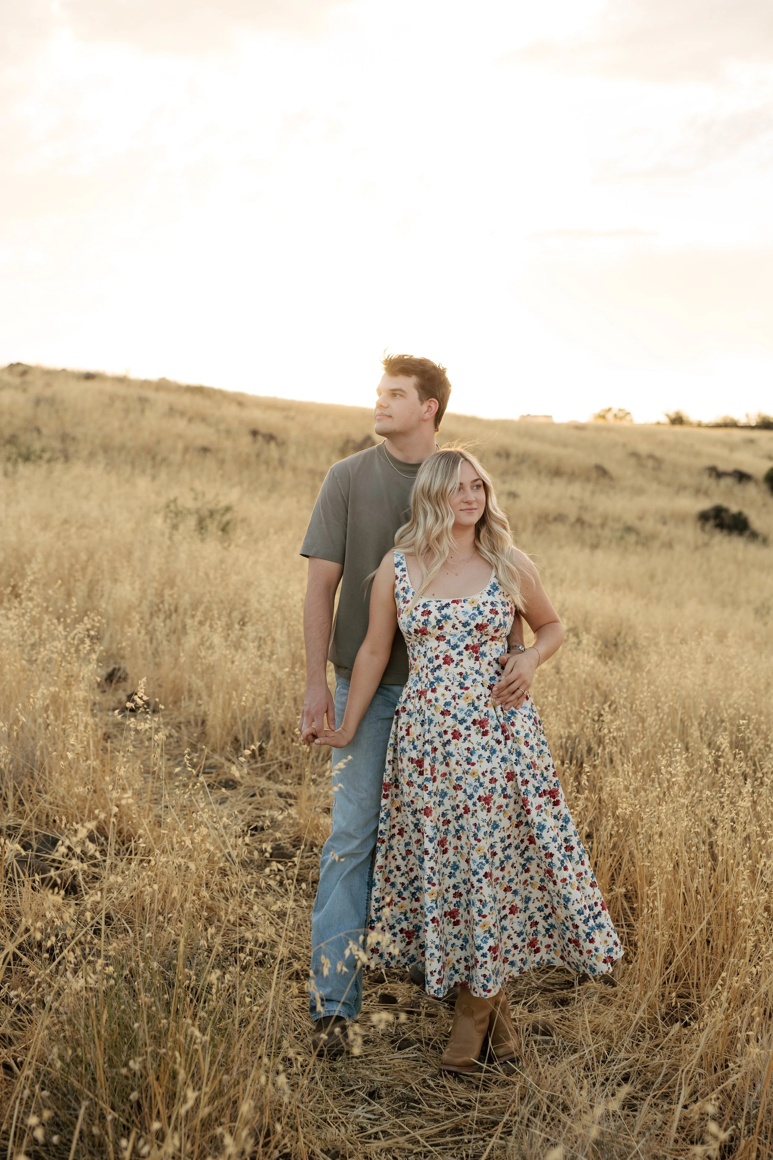 Editorial-style Arizona engagement photos featuring golden fields and mountain views