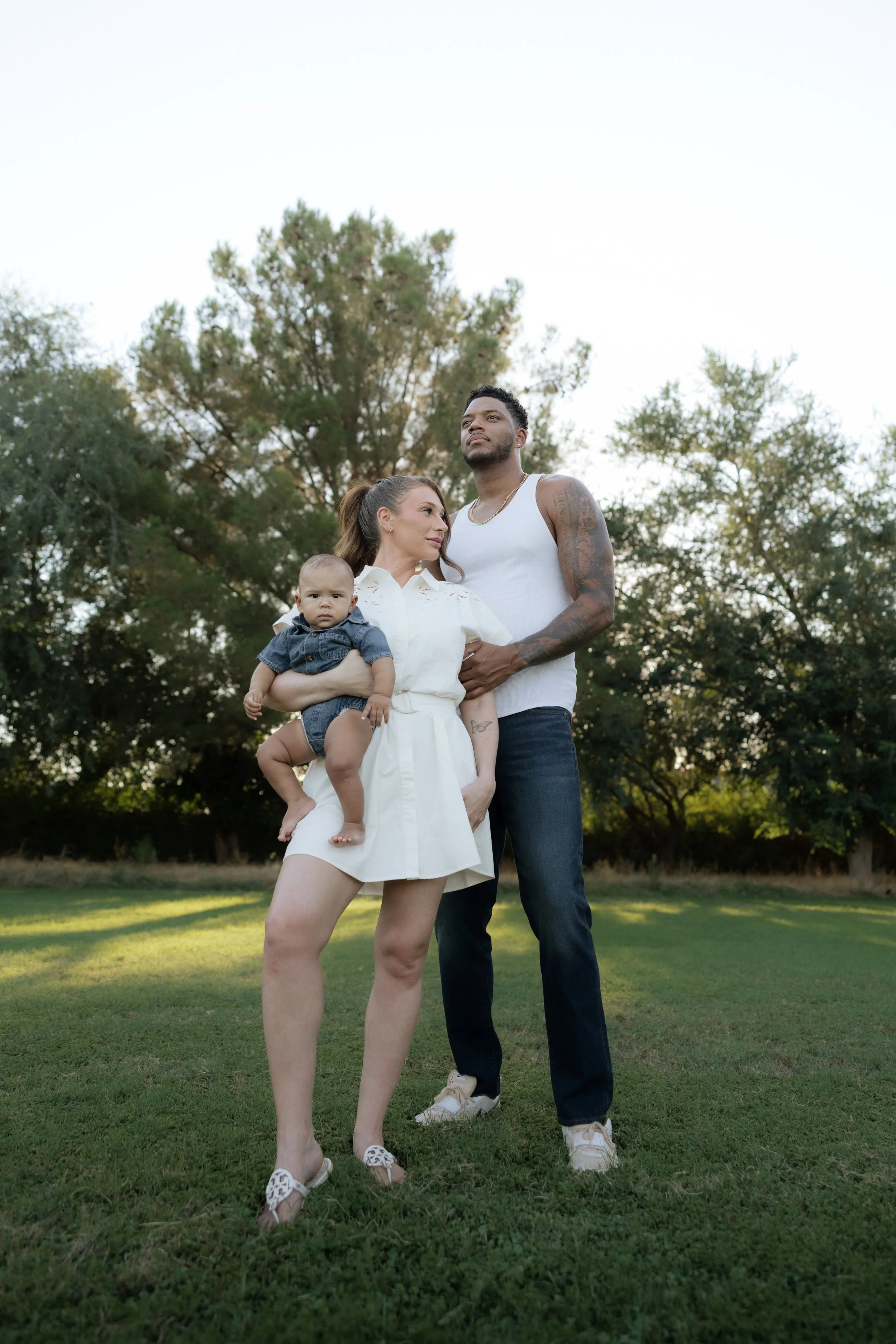 Lifestyle family photographer capturing young family at sunset in queen creek arizona