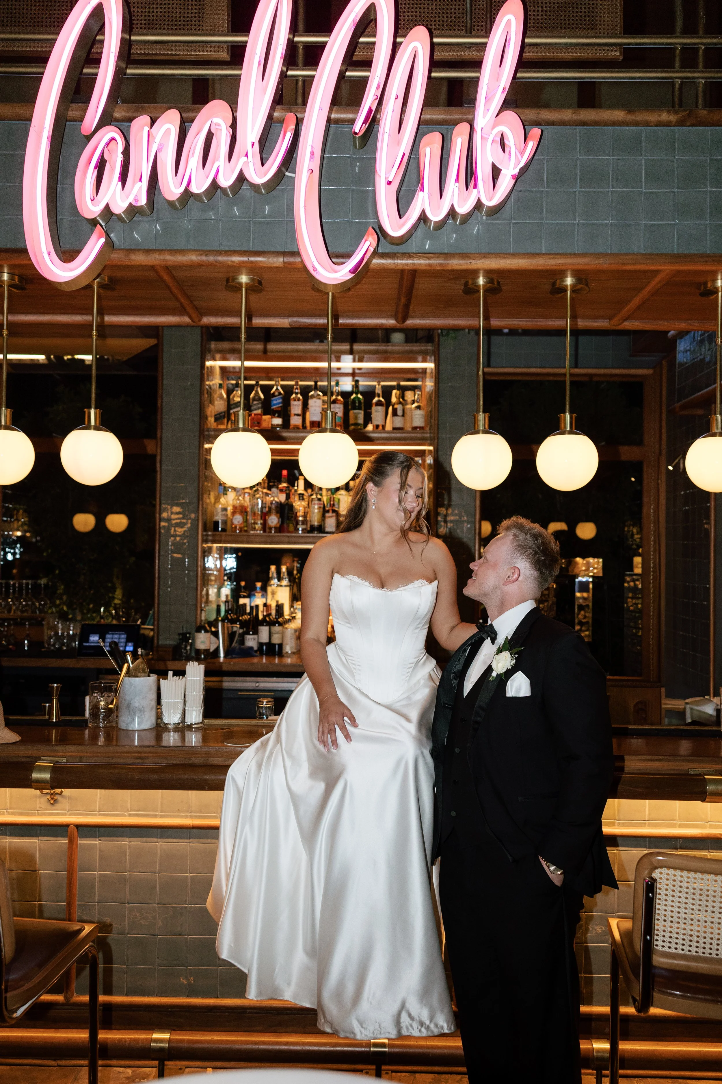 Bride and groom seated at The Canal Club bar at The Scott Resort & Spa in Scottsdale, Arizona